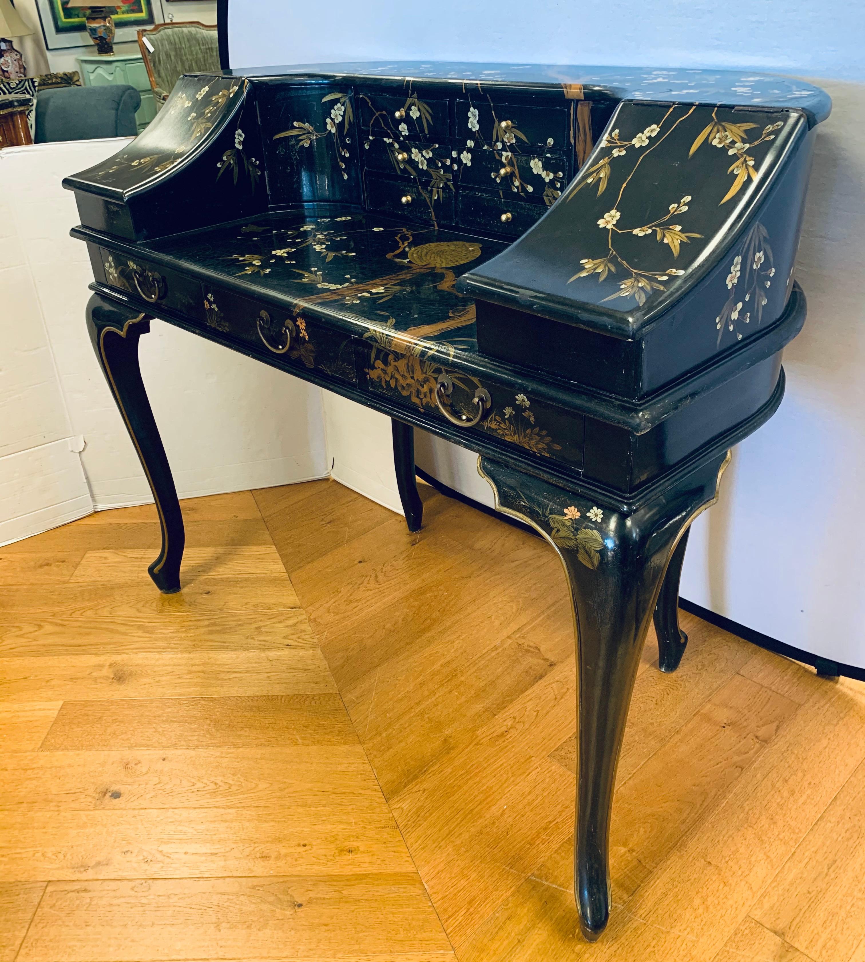 Magnificent vintage black lacquer chinoiserie Carlton desk by Maitland Smith. Age appropriate wear but still in great shape. And replete with Carlton style lines, circa 1970s. Features red drawers.