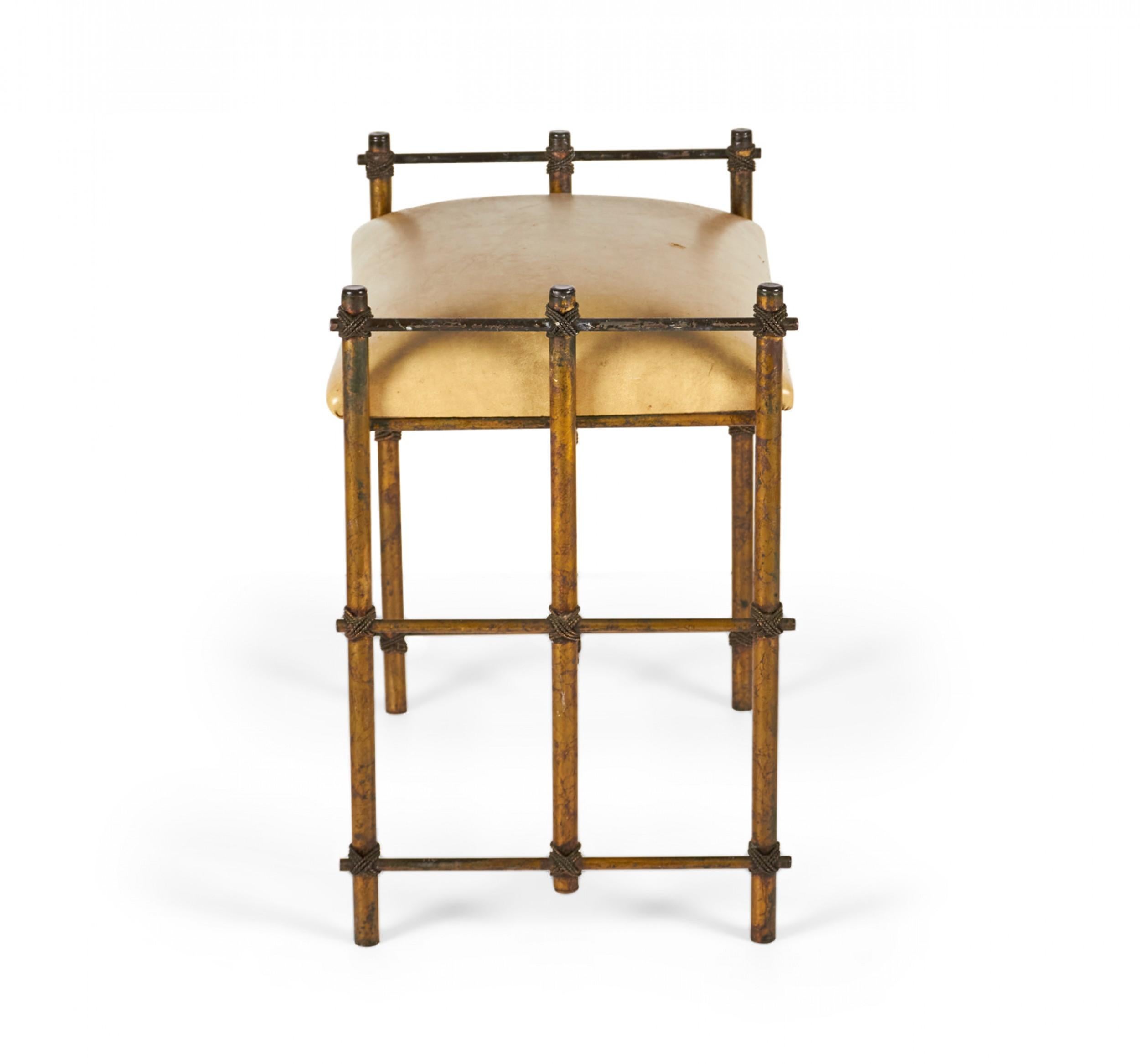 Vintage vanity bench with a patinated giltwood frame comprised of three dowel supports on either side connected with decoratively tied rope at the cross-sections and joined in the center by two stretcher dowels to support a beige leather upholstered
