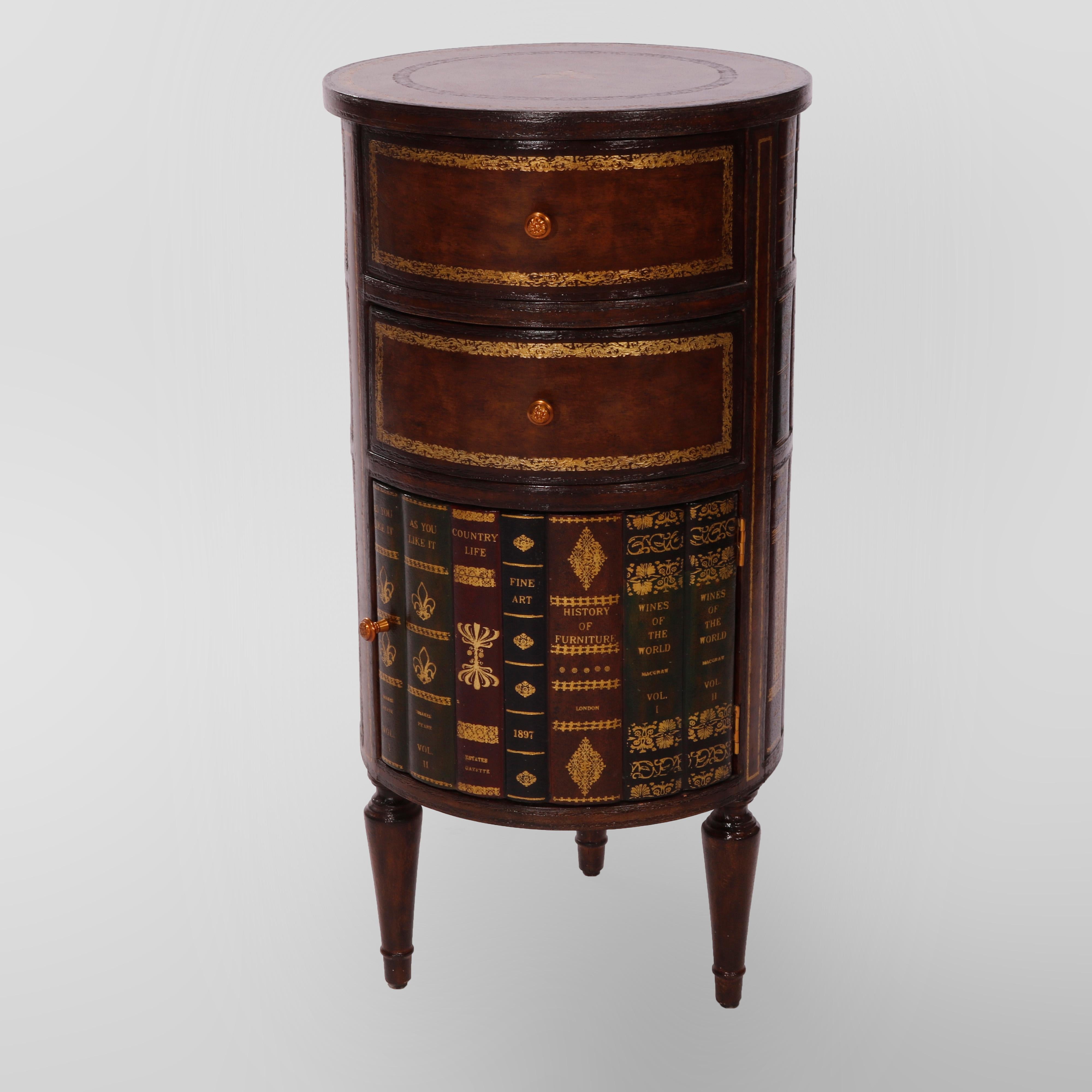 A cabinet side stand by Maitland Smith offers walnut construction in cylidrical form with gilt decorated leather top over library themed case having double drawers over lower cabinet, tooled leather faux book facing throughout, raised on tapered
