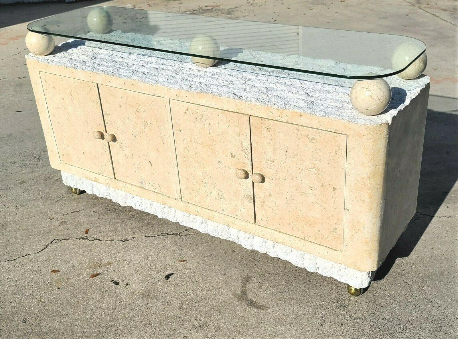 Offering one of our recent Palm Beach estate fine furniture acquisitions of
1980's postmodern tessellated & mactan stone credenza buffet dry bar
designed in the style of Maitland smith and attributed to Magnusson.

Featuring Tessellated stone