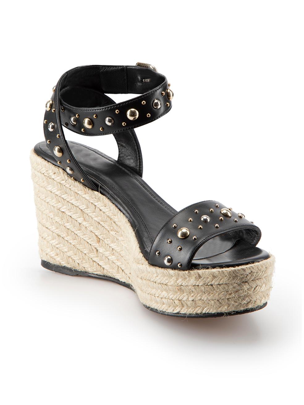 CONDITION is Very good. Hardly any visible wear to sandals is evident on this used Maje designer resale item. These shoes come with original box and dust bag.
  
  
  
  Details
  
  
  Black
  
  Leather
  
  Espadrille wedges
  
  Platform
  
 