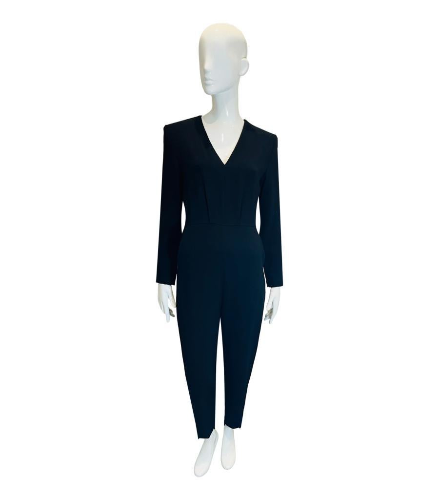 Maje Jumpsuit

Black jumpsuit designed with V-Neckline and cropped stem hems.

Featuring side slit pockets, straight leg silhouette and concealed zip closure to rear. 

Size – 40FR

Condition – Very Good (Minor mark to the sleeve)

Composition – 78%