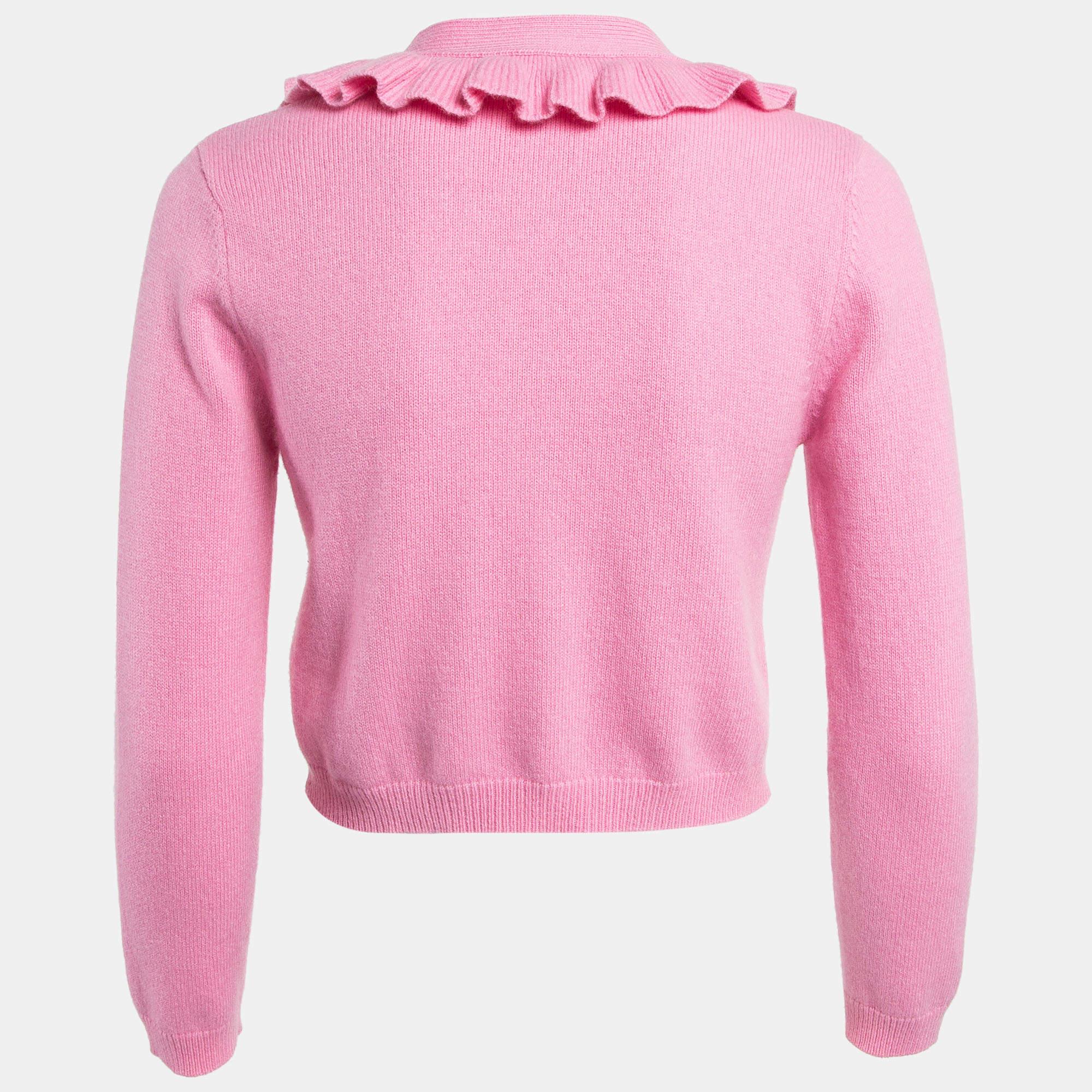 Experience chic comfort with the Maje cardigan. Crafted with precision this cozy piece features delicate frill accents adding a touch of femininity to your ensemble. Its soft ribbed knit fabric ensures both warmth and style making it a versatile