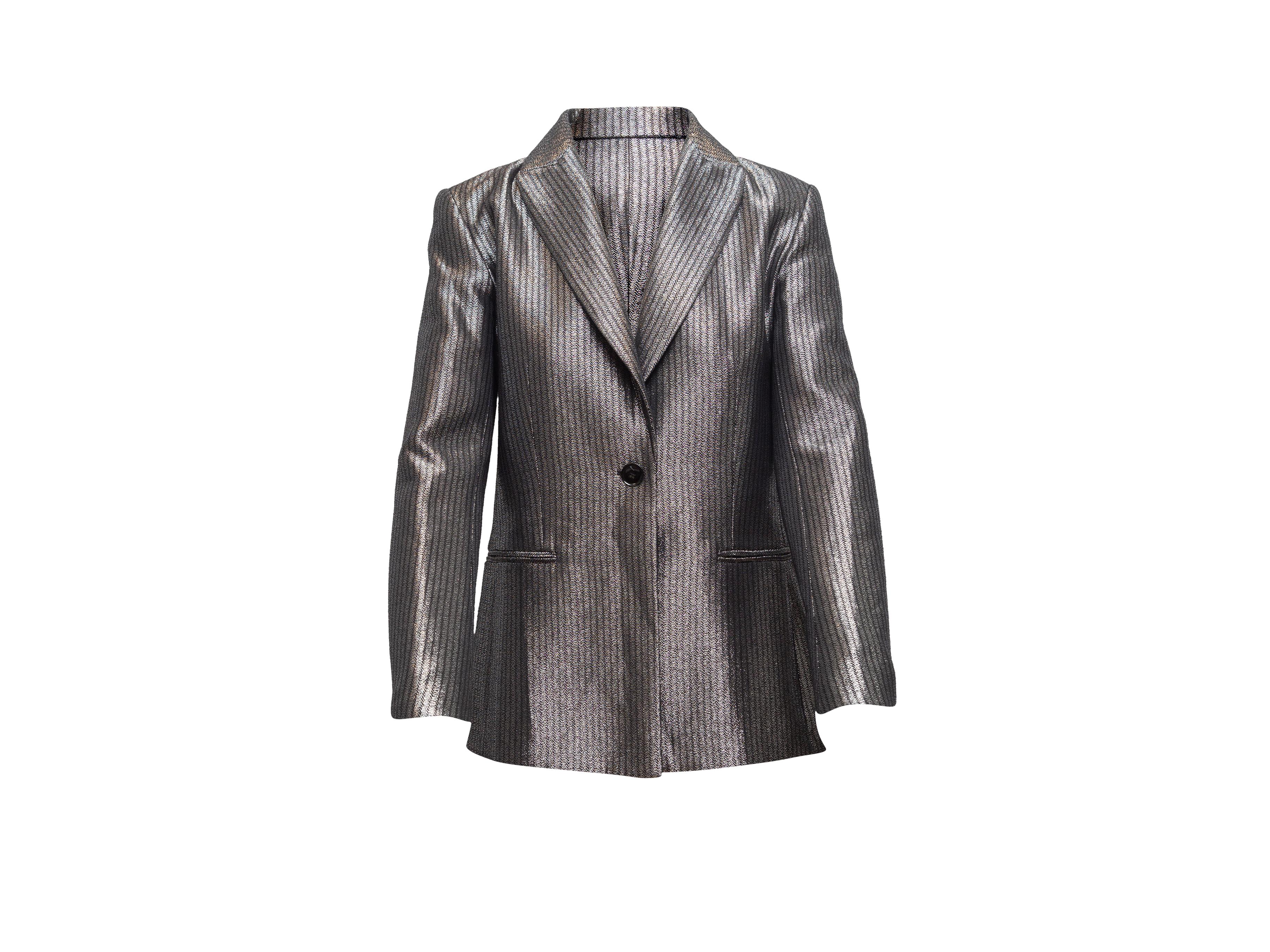 Product details: Silver metallic pinstriped blazer by Maje. Notched lapel. Dual welt pockets at hips. Single button closure at front. Designer size 36. 32