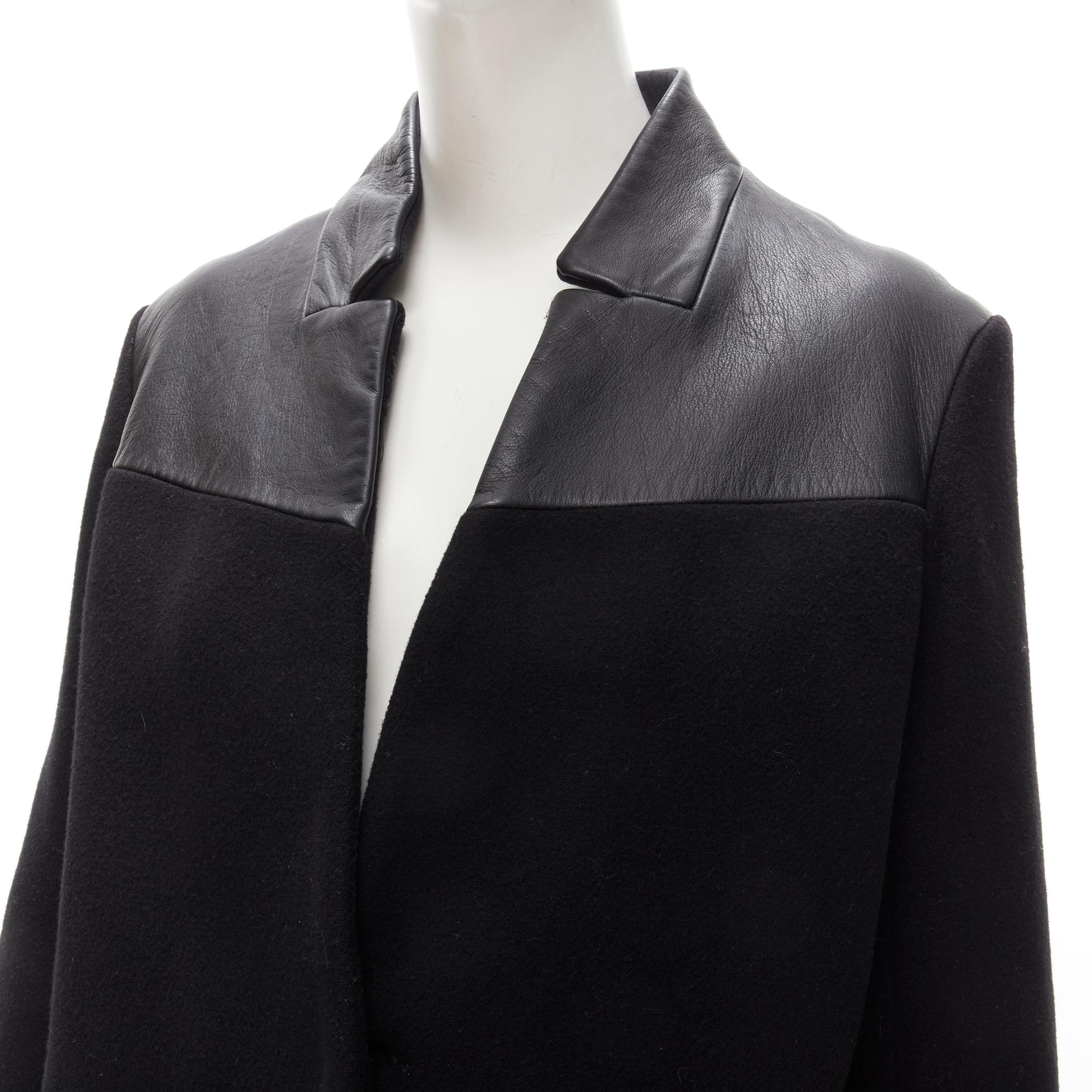 MAJE Sirop black calfskin leather trim wool collarless coat US2 S
Brand: Maje
Extra Detail: Single concealed button front. Dual side seam pockets.

CONDITION:
Condition: Excellent, this item was pre-owned and is in excellent condition. Crease on
