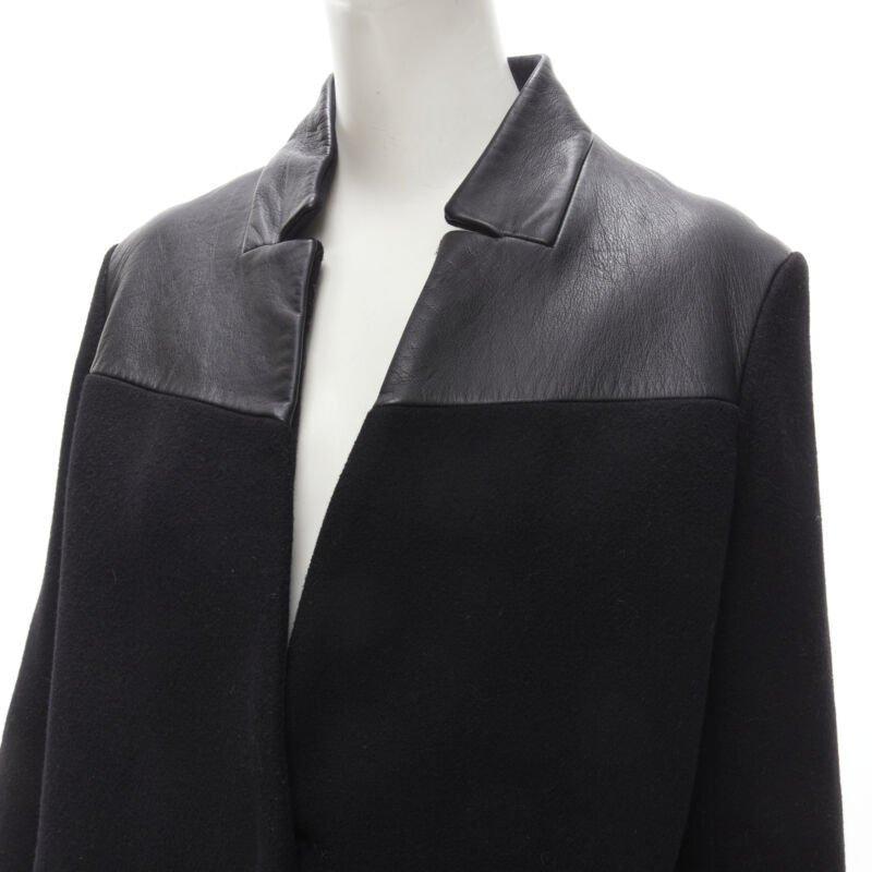 MAJE Sirop black calfskin leather trim wool collarless coat US2 S
Reference: KNLM/A00069
Brand: Maje
Material: Wool, Leather
Color: Black
Pattern: Solid
Lining:  Viscose
Extra Details: Single concealed button front. Dual side seam pockets.
Made in:
