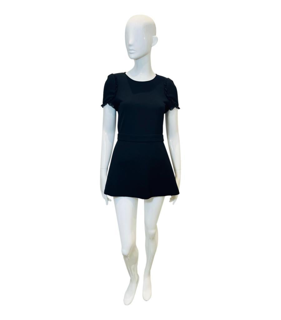 Maje Skirt-Effect Romper

Black 'Ively' romper designed with skirt-effect shorts overlay.

Detailed with lace-trimmed short sleeves and banded waist with elasticated back.

Featuring round neckline and concealed zip fastening to rear. Rrp £270

Size