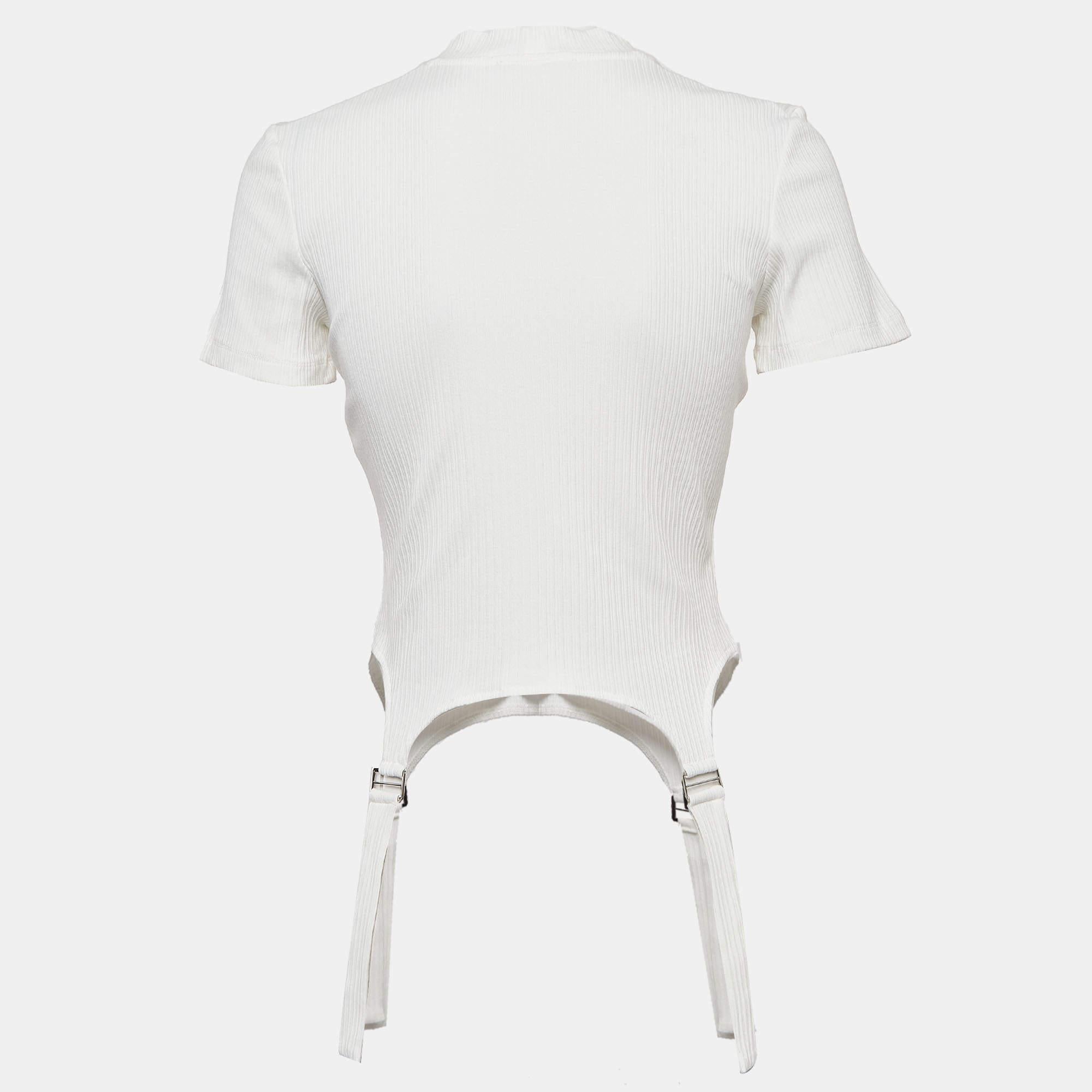 Drape yourself in the effortless charm of the Maje top. Crafted with precision, its rib-knit fabric embraces you in luxurious comfort. Delicate strap details add a hint of intrigue to this versatile piece, perfect for both casual outings and