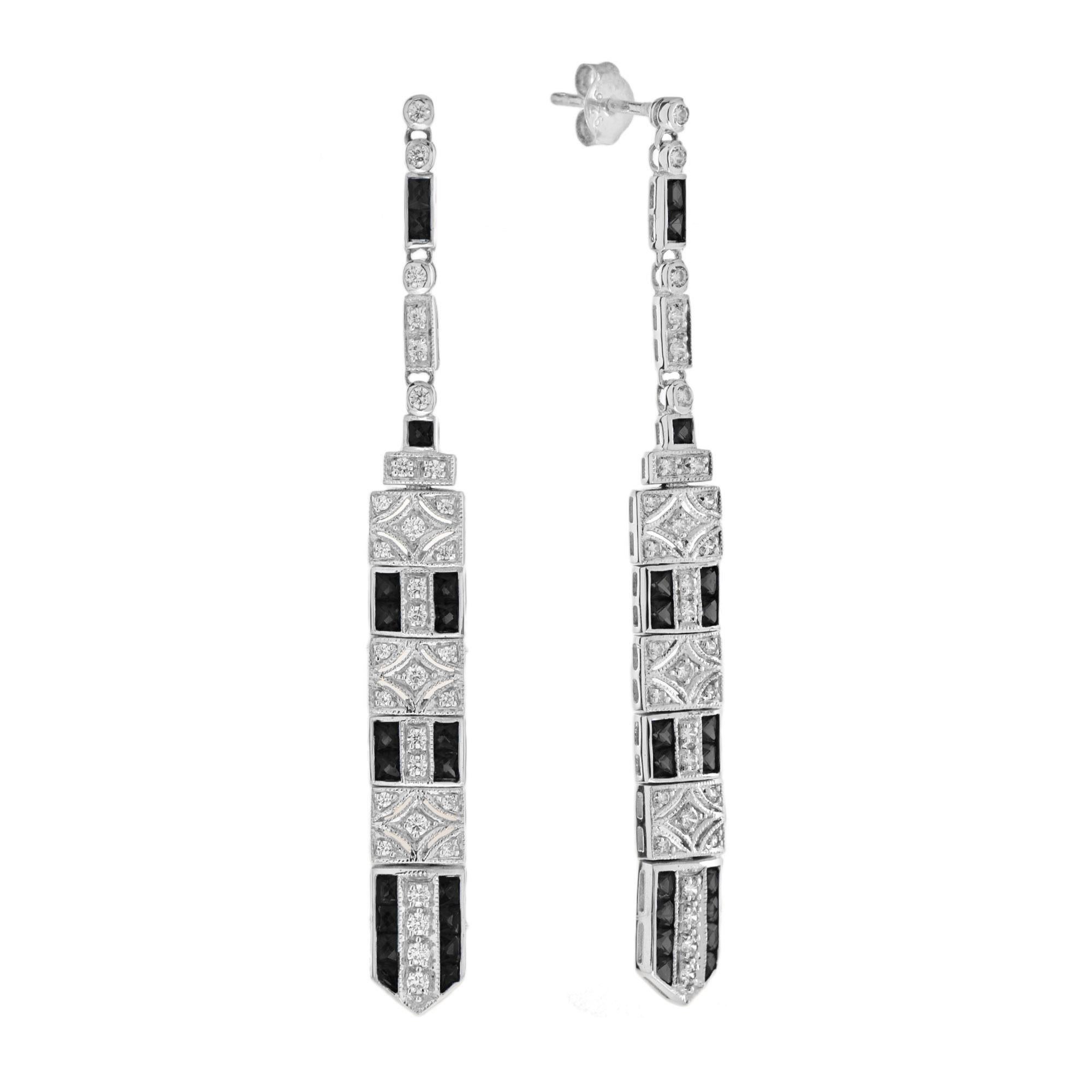 These art deco bar dangle earrings are the epitome of vintage-inspired elegance featuring mesmerizing geometric patterns feature with onyx and diamonds.

Information
Metal: 14K White Gold
Width: 6 mm.
Length: 62 mm.
Weight: 7.90 g. (approx. total
