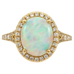 Majestic 14K Yellow Gold Oval-Cut Opal Ring with Diamond Encrusted Halo