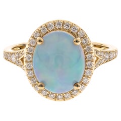 Majestic, anello in oro giallo 14K con opale taglio ovale e diamante a raggiera