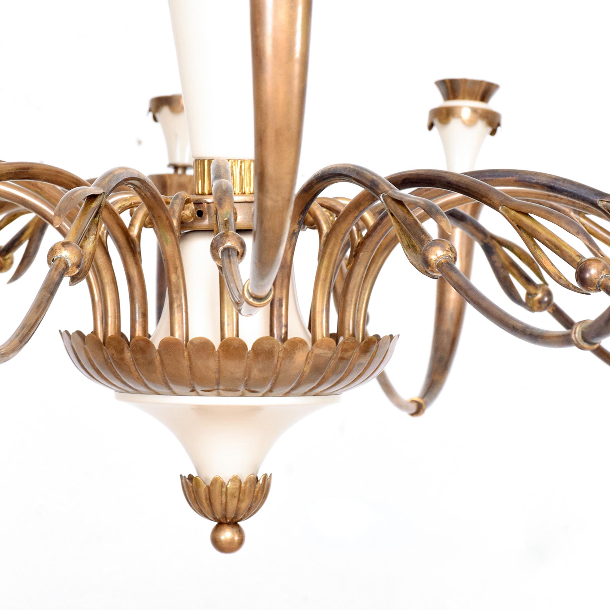 Chandelier
Sixteen (16) arm Sculptural Scallop Italian chandelier ITALY 1950s
Unmarked
Painted aluminum and patinated brass
Dimensions: 42.5in diameter x 25 tall. Decorative brass chain approximately 46 tall.
Similar to the designs of Guglielmo