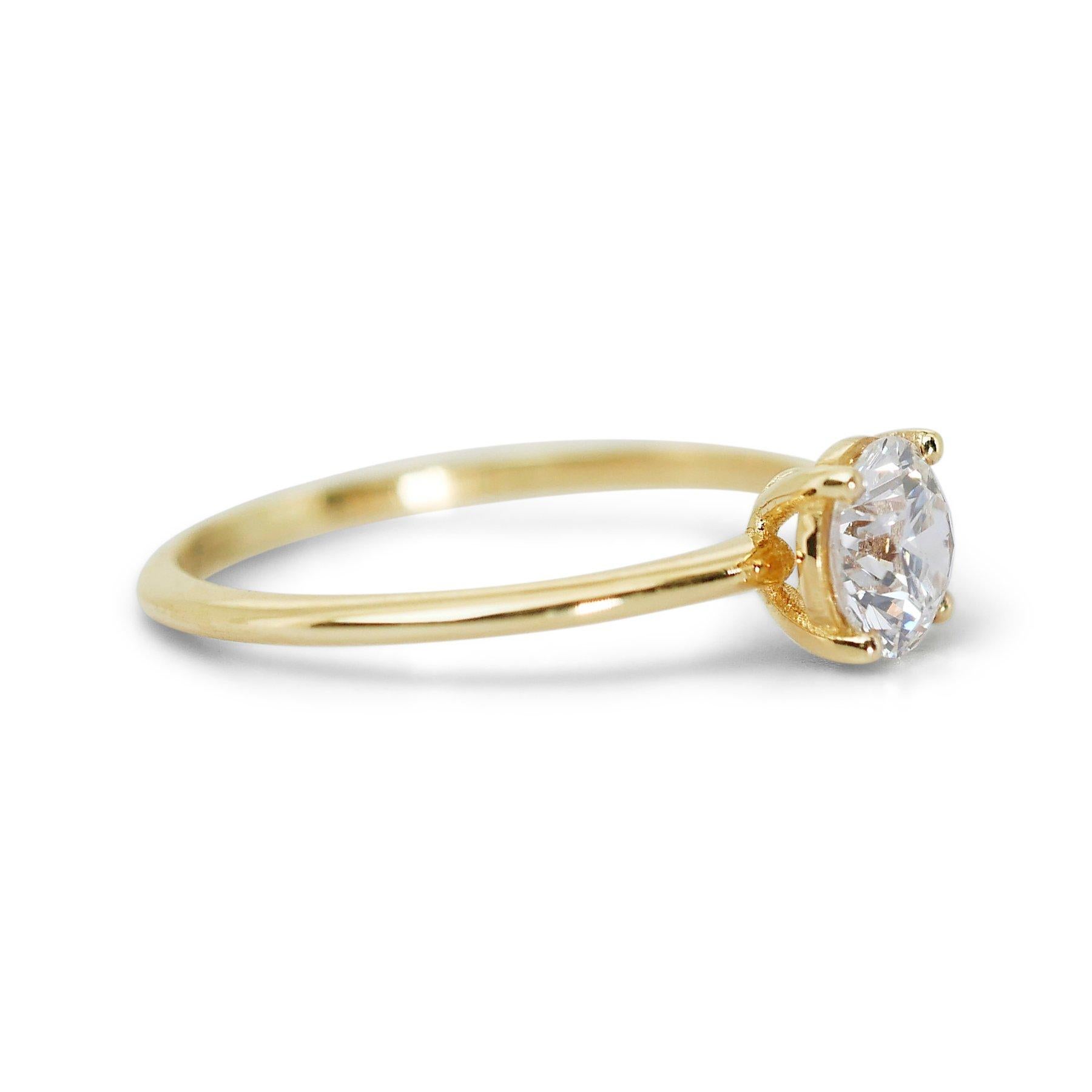 Unveiling a truly enchanting piece of solitaire ring that seamlessly blends grace and sophistication. The focal point of this exquisite adornment is a mesmerizing ideal cut triple excellent diamond main stone, elegantly weighing 1.03 carats. The