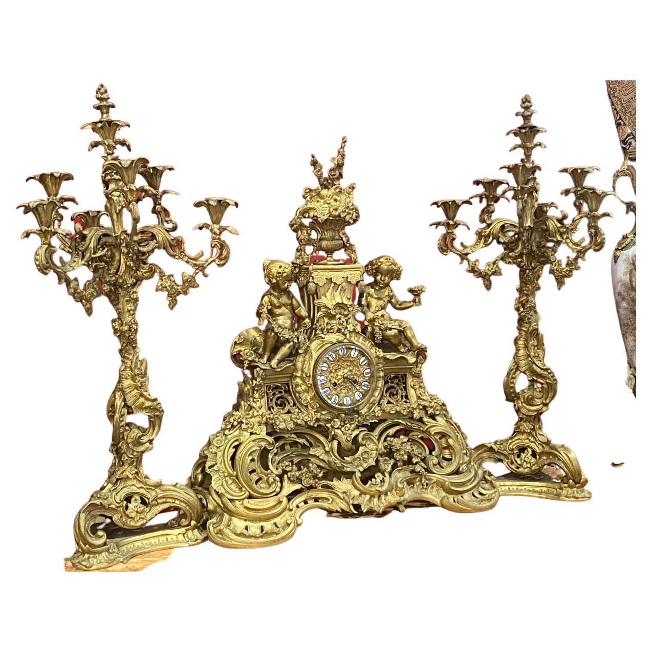 Majestic 19th Century French Gilt Bronze Candelabras and Clock Garniture