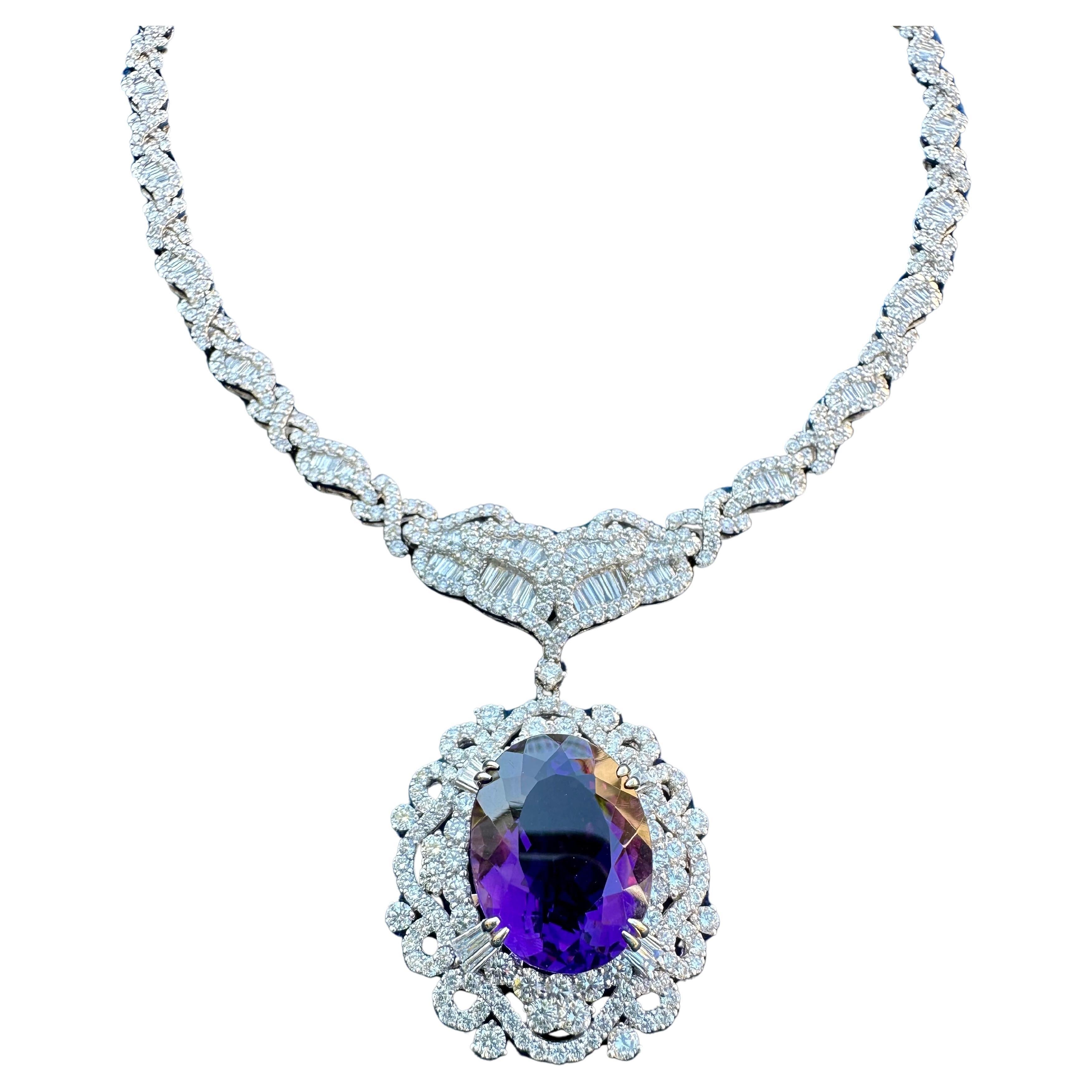 Magnificent, very majestic and opulent in real life, huge natural intense purple Brazilian Amethyst and diamond necklace is prong set in 18 karat white gold and has a combined total weight of approximately 52.10 carats.

Necklace features a 19.10