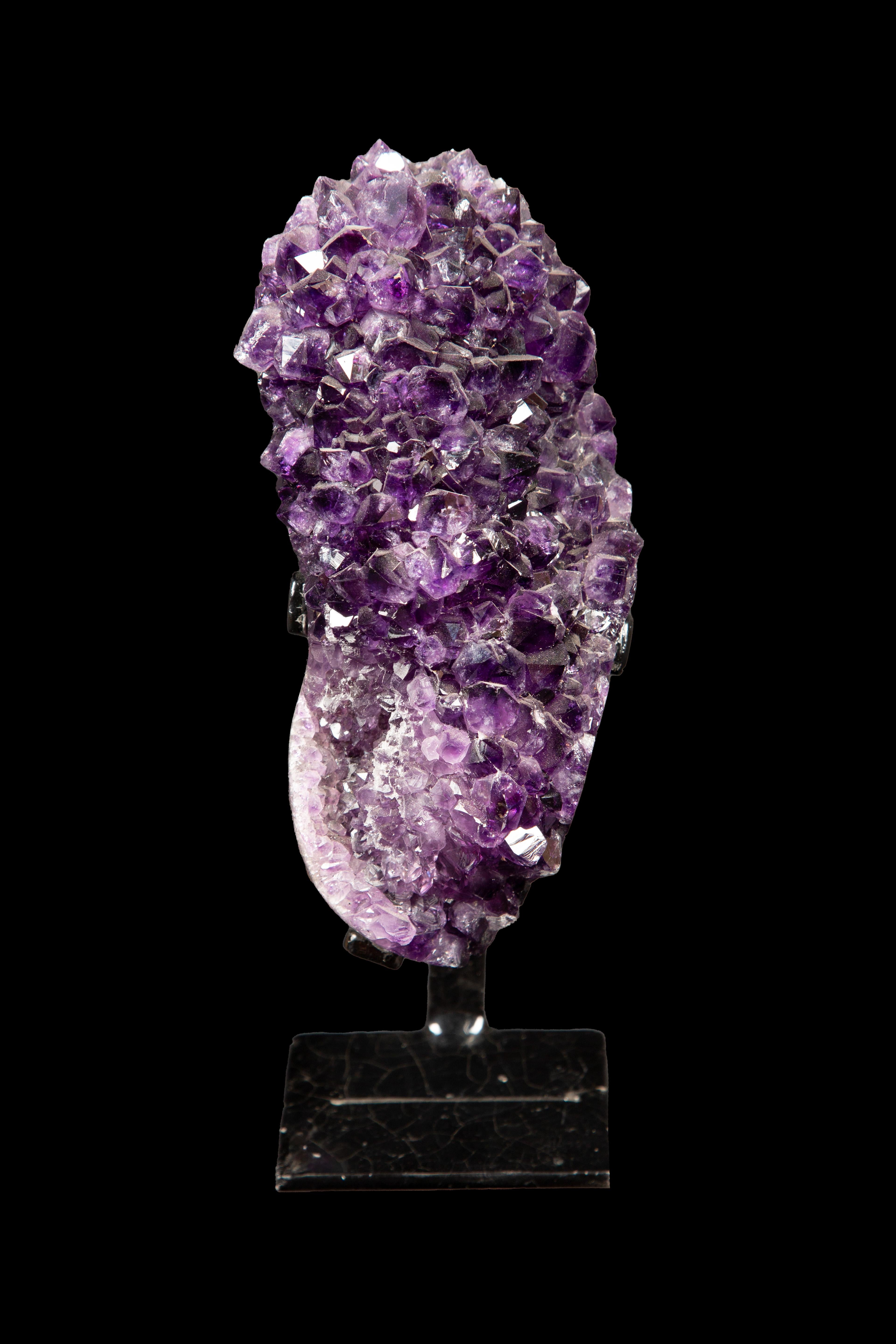 Elevate your crystal collection with this mesmerizing Amethyst Specimen, exquisitely presented on a meticulously crafted custom metal base. Standing at an impressive height of 10 inches, this stunning piece showcases the natural beauty of amethyst