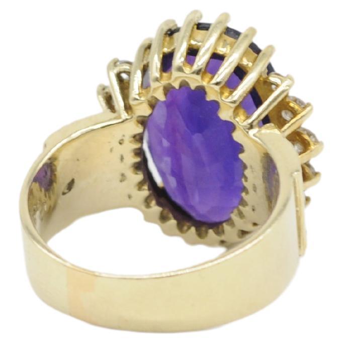 Immerse yourself in the ethereal beauty of this captivating amethyst ring—an absolute statement of beauty, charm, wealth, and sophistication. Crafted in exquisite 14k yellow gold, this ring features a centerpiece amethyst with a unique and
