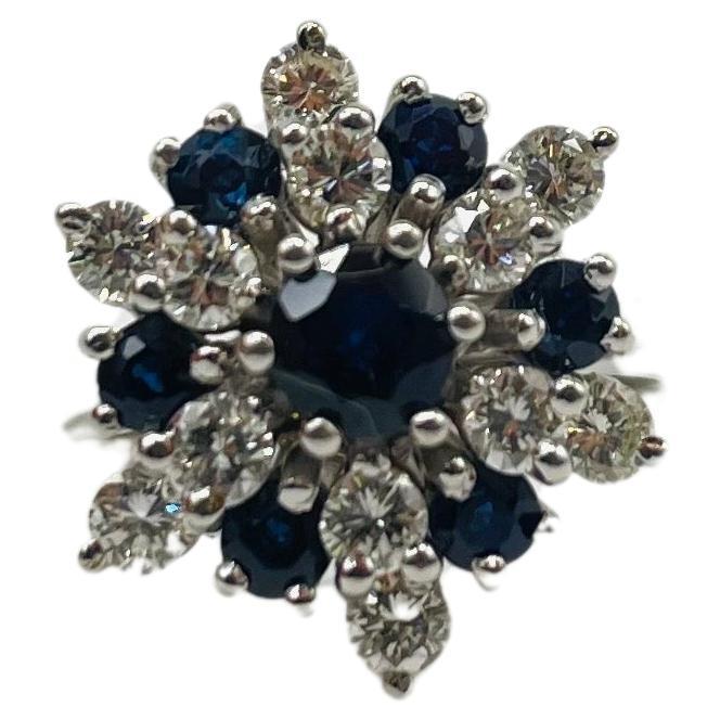 Immerse yourself in the dreamlike beauty of this exquisite 18k white gold pendant adorned with captivating diamonds and sapphires. This stunning piece features a total of 12 diamonds, each meticulously cut in brilliant fashion, and seven sapphires,