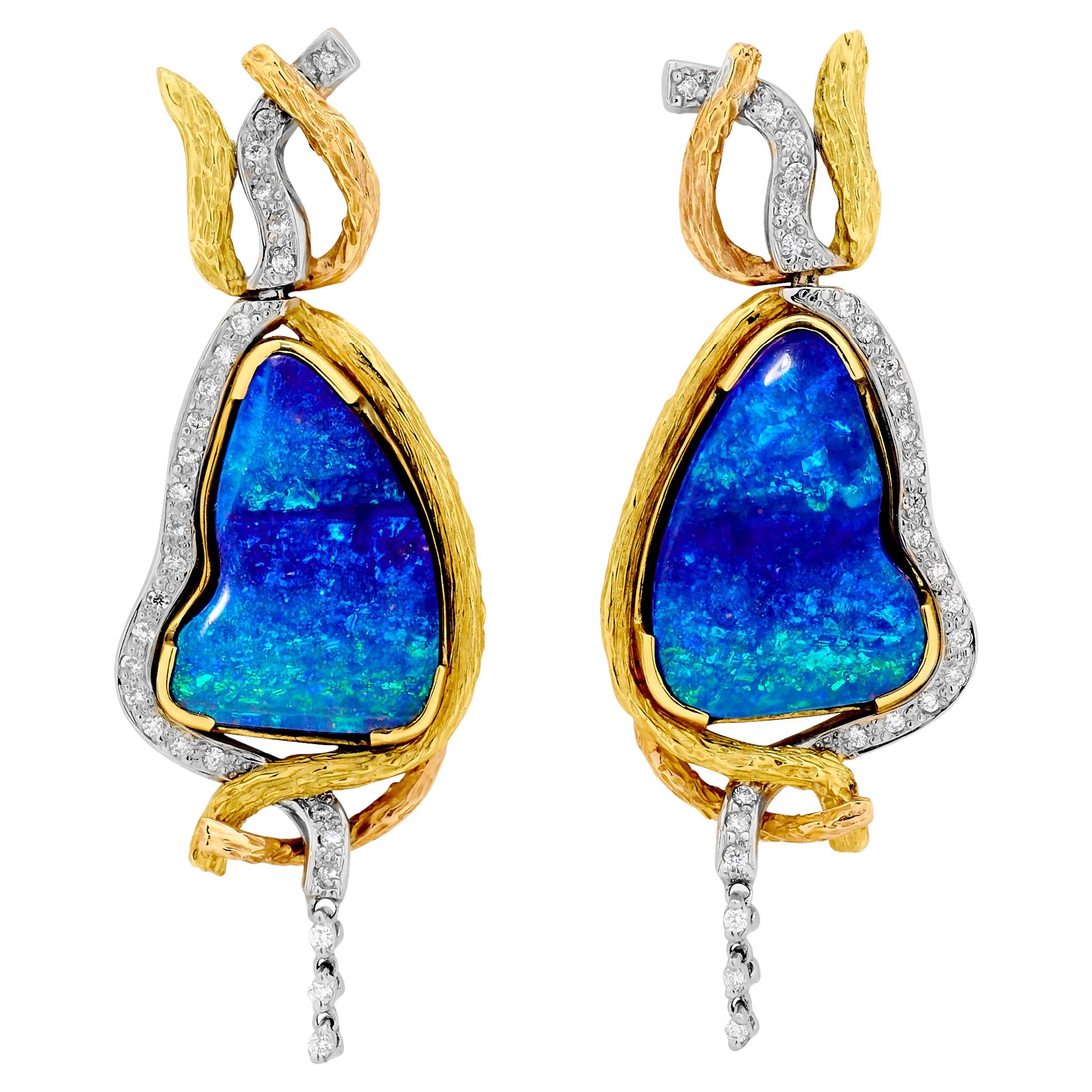 The power of nature cradling the remnants of the ancient civilisation of Angkor in Cambodia inspired Renata Bernard to create the marvelous Ta Prohm set of Australian opal pendant, ring, and earrings. 

The 'Ta Prohm' boulder opal pendant is an