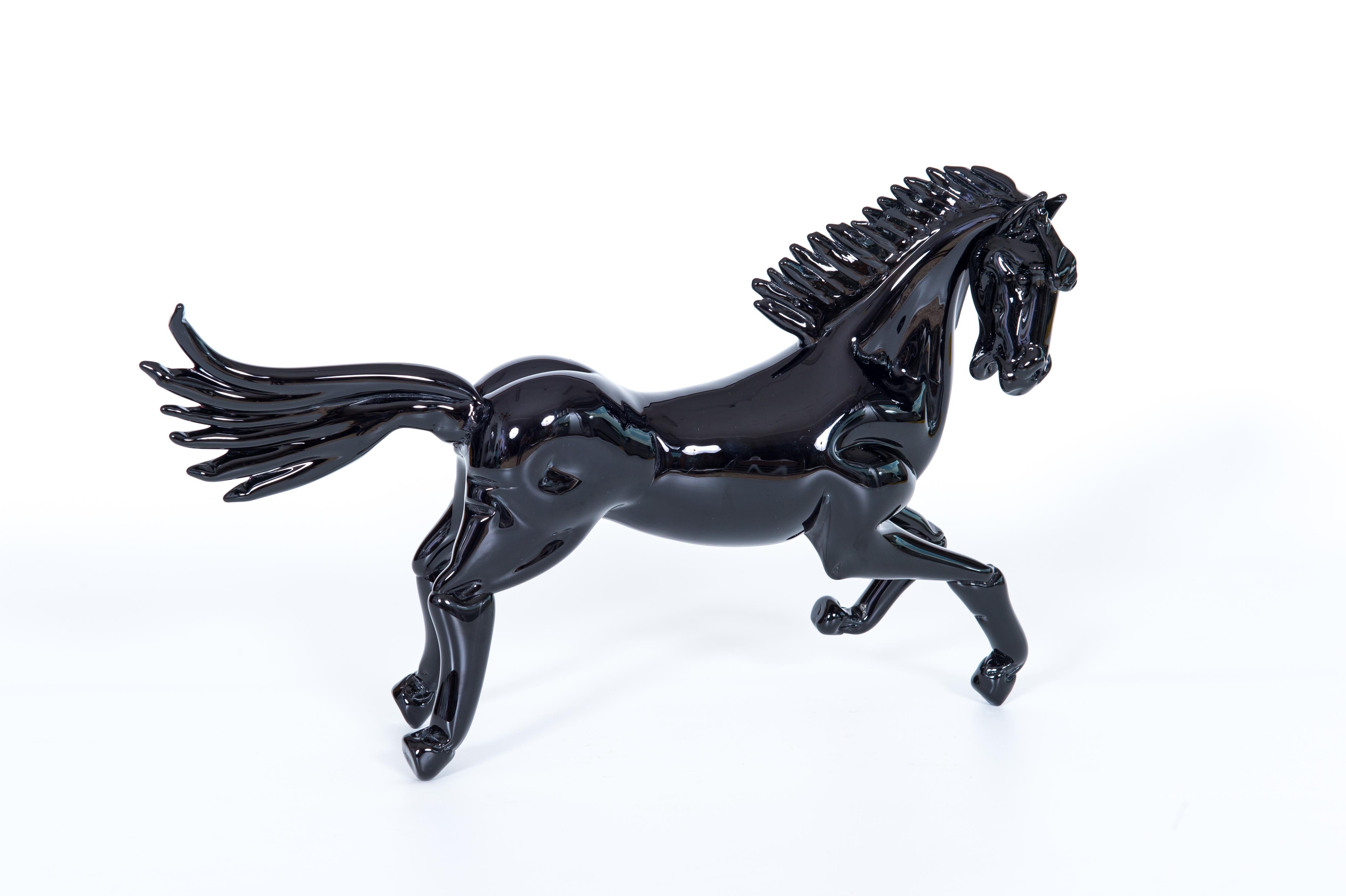 Majestic Black Horse Sculpture in Blown Murano Glass Venice Italy 21st Century.
This statue depicting a galloping horse is a beautiful collector's item for all lovers of quality Murano glass and animal sculptures. Completely handmade in the 2000s of