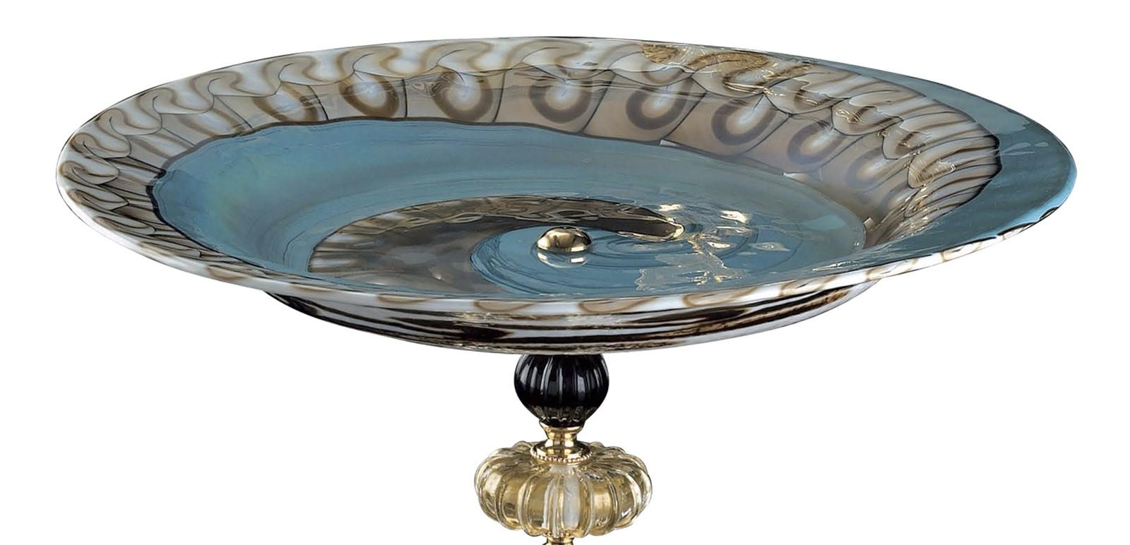 This majestic centerpiece makes a beautiful addition to any table. Its round base is in 24k gold plated brass supports a striking multicolored striking sculptural piece of Murano glass bearing a round shape, ideal for displaying any item of your