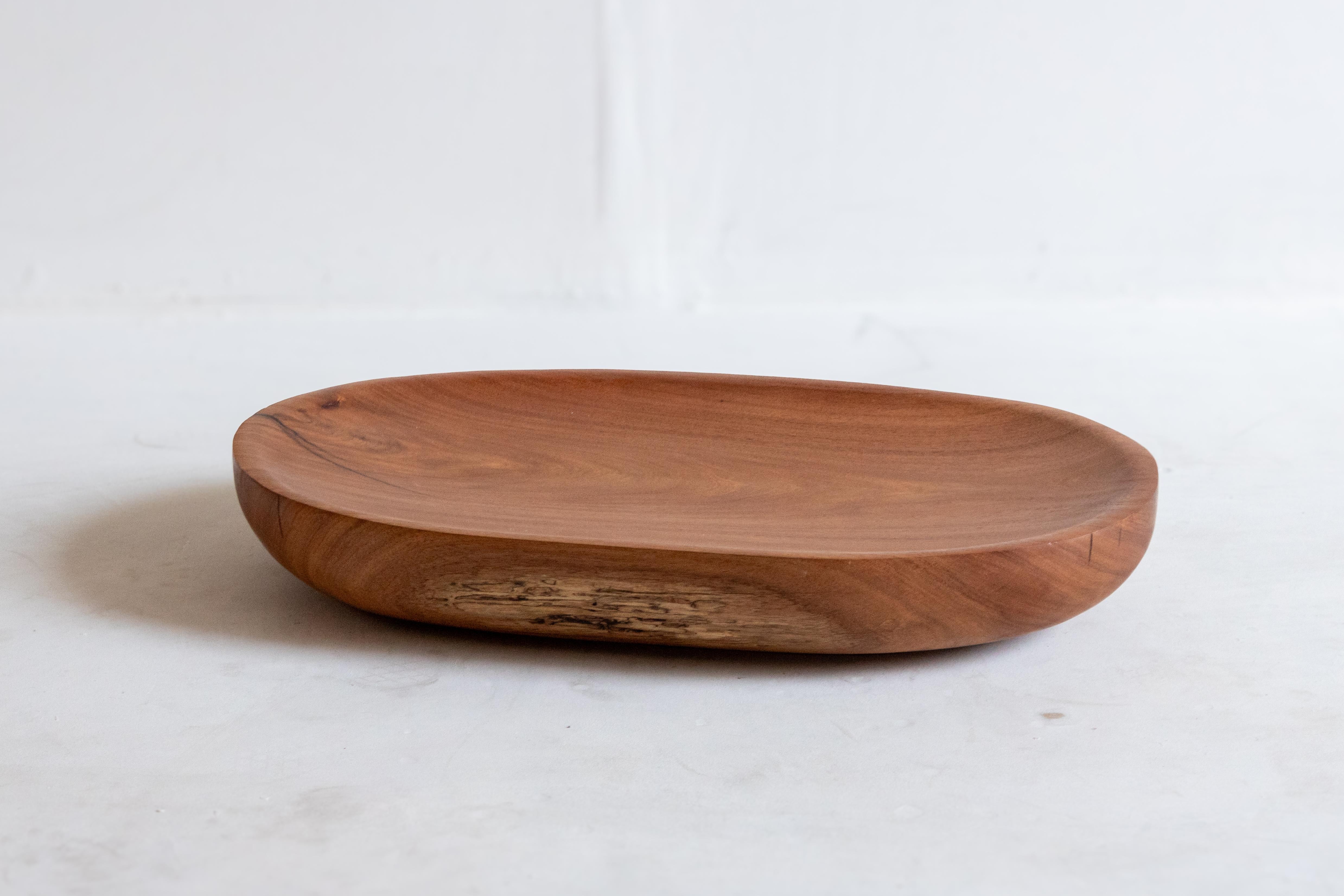 This exquisite bowl, hand-carved from reclaimed Tzalam wood, is a remarkable design piece originating from the Mayan jungle. Known for its rich, warm tones and distinctive grain patterns, Tzalam wood lends a unique character and elegance to each
