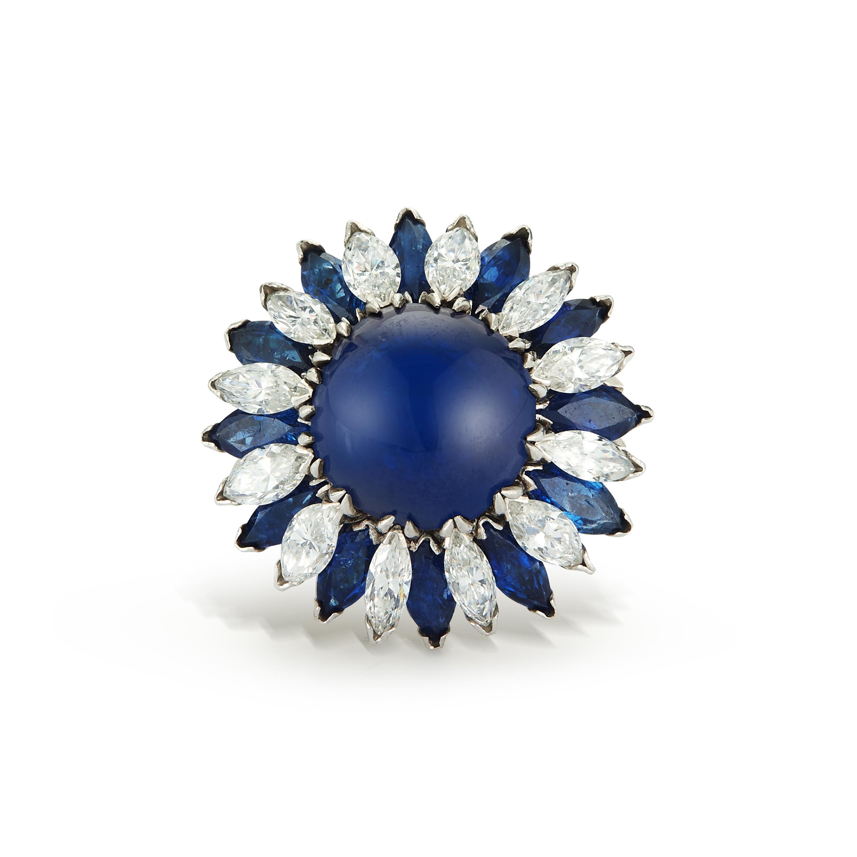 Majestic Cabochon Sapphire and Diamond Cocktail Ring

This stunning Natural Cabochon Sapphire Cocktail Ring features a captivating 9.71-carat cabochon sapphire as its centerpiece, certified by AGL as natural and free of enhancement. The deep blue