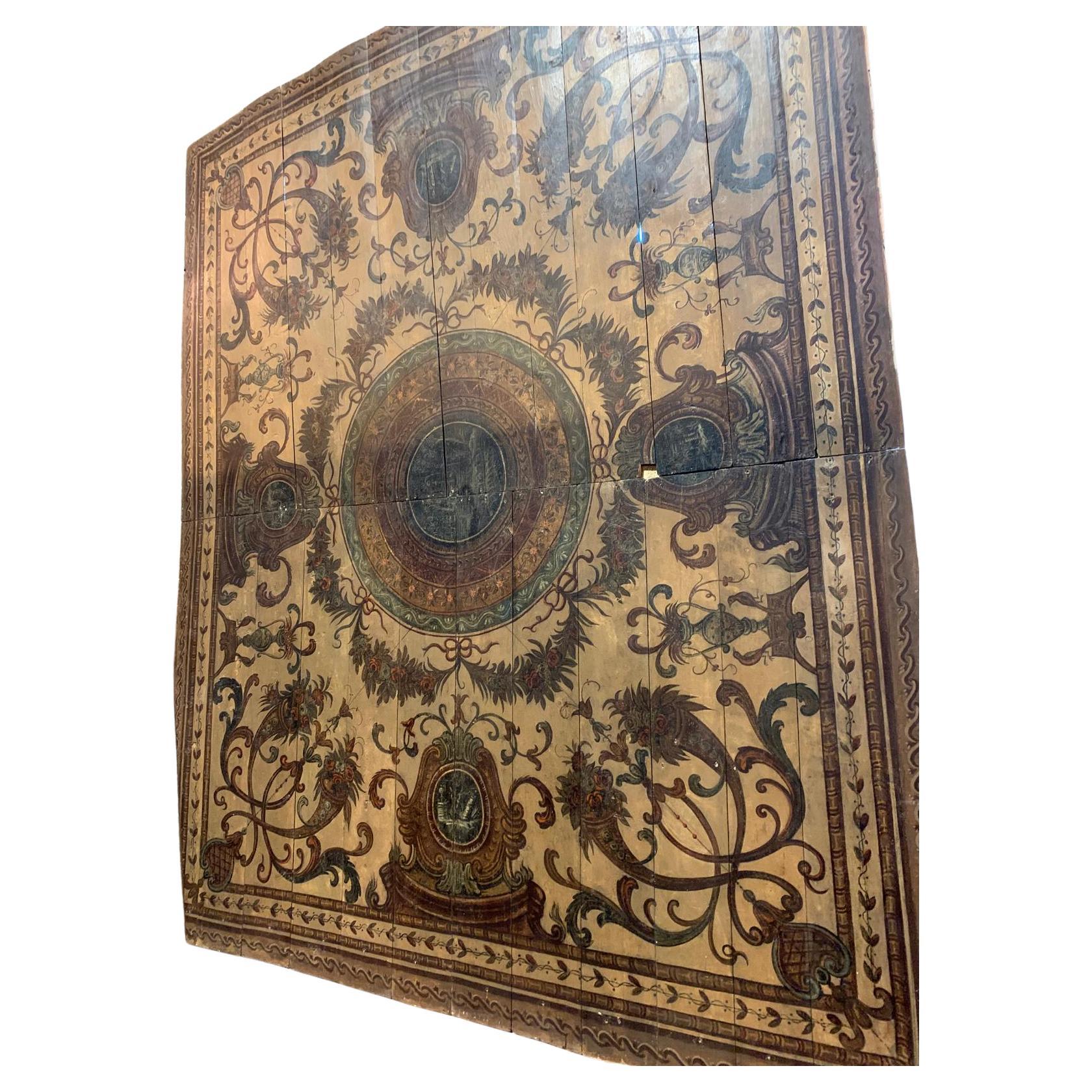 Majestic and ancient ceiling with lacquered and hand-painted wooden planks, Centrally it presents colored and painted circles to create depth as if it were a dome, surrounded by festoons, all hand-painted by a master of the time.
On each side we