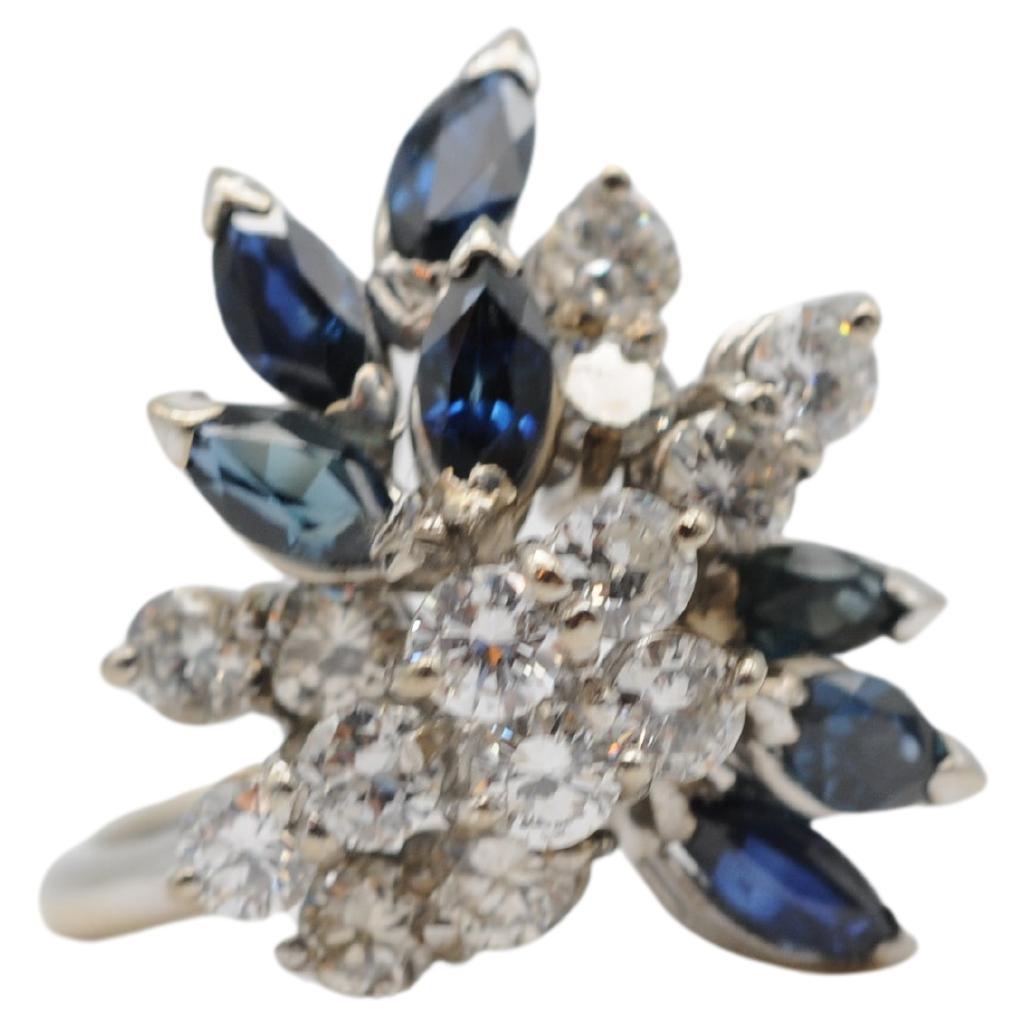 Enter the realm of majesty with this breathtaking 18k white gold ring adorned with diamonds and sapphires. This stunning piece features a total of 7 sapphires, each weighing approximately 0.15ct, with a combined weight of approximately