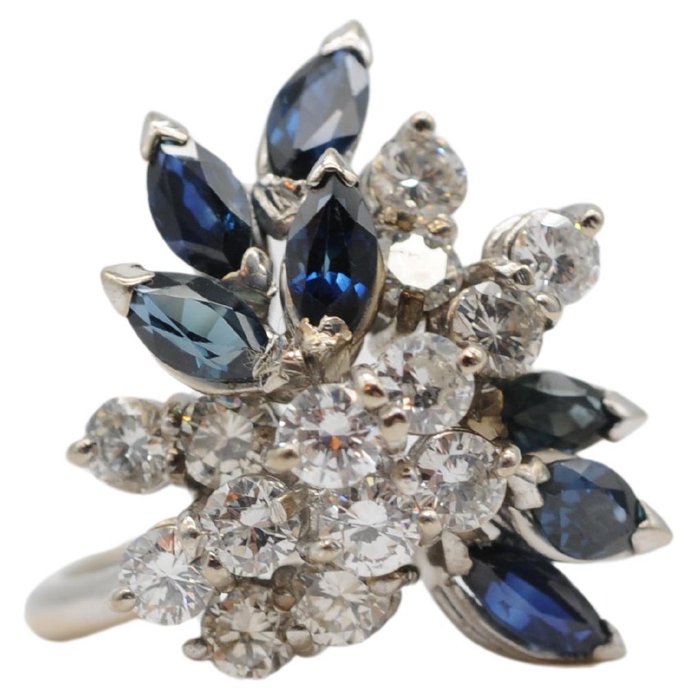 Majestic cluster ring with diamonds and sapphire in 18k white gold For Sale