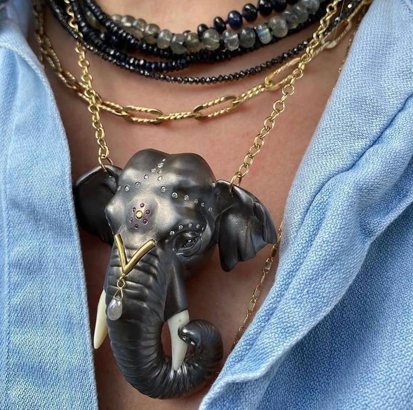Bold and beautiful, this exquisite elephant necklace pays homage to the regal elephant. 
This magnificent elephant has been carved in wax by New York-based artist Manya Tessler, then cast in Sterling silver and oxidized, contrasting with the solid