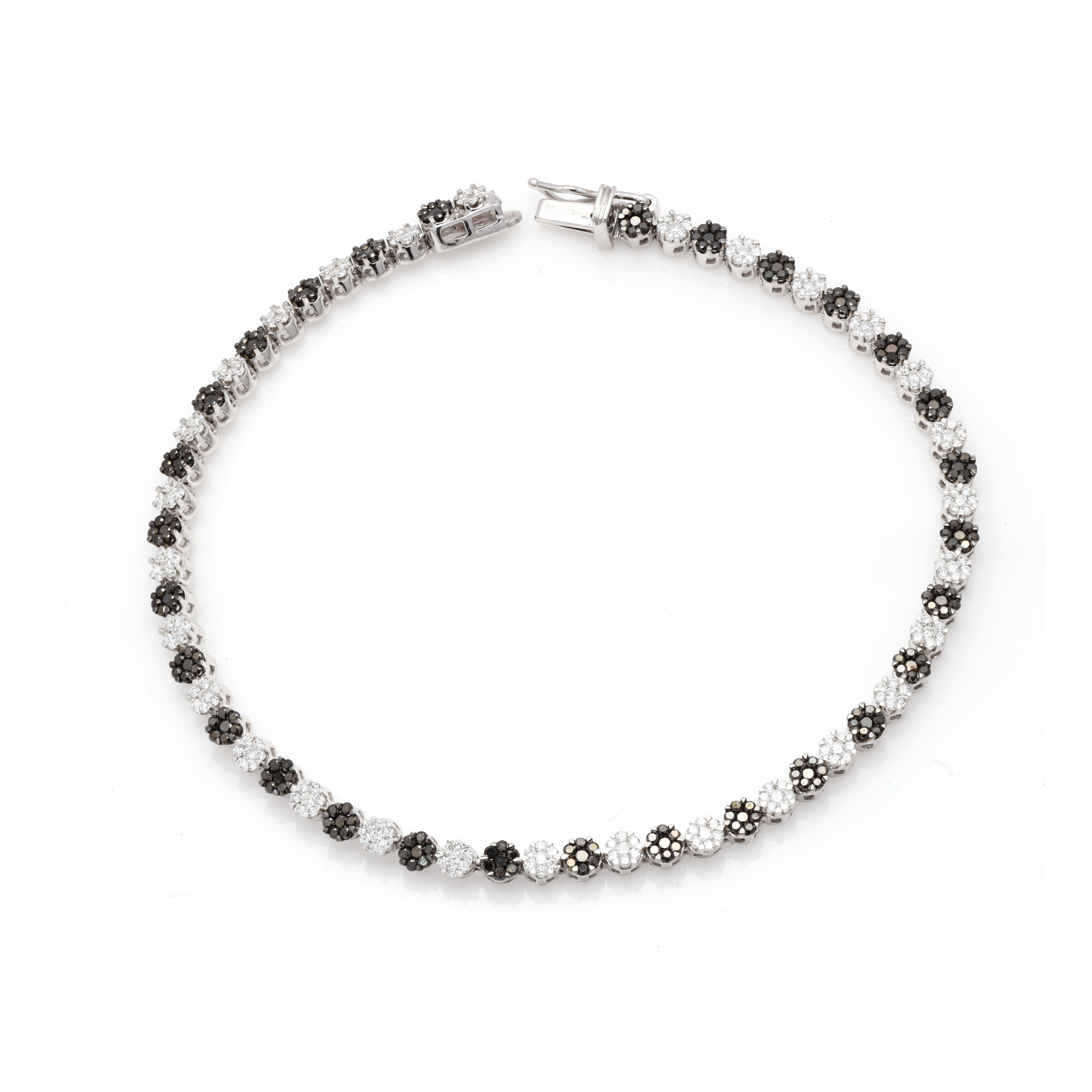 Brilliant 2.16 ct Black White Diamond Tennis Bracelet in 18K gold. It has a perfect round cut diamonds to make you stand out on any occasion or an event. 
April birthstone diamond brings love, fame, success and prosperity.
Featuring 2.16 cts of