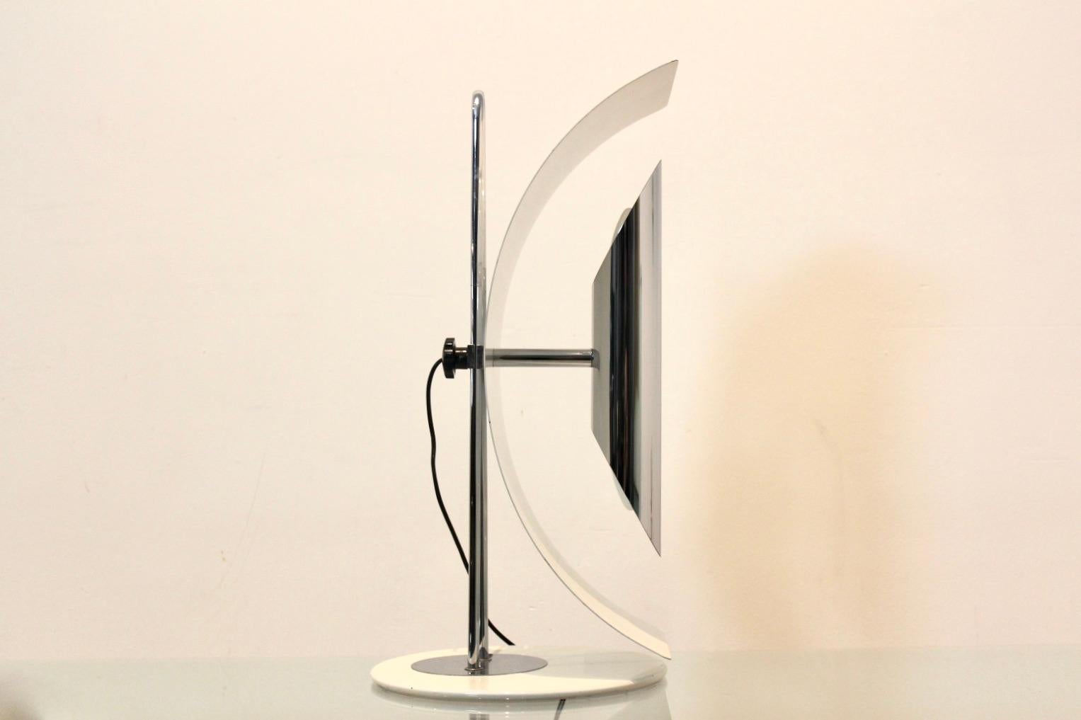 Iconic Goffredo Reggiani Italian table lamp made by Studio Reggiani, Italy, 1960s. White and chrome base with a moon shaped shade and chrome holder for two-light bulbs. Very sophisticated and beautiful light. The shade is horizontally and vertically