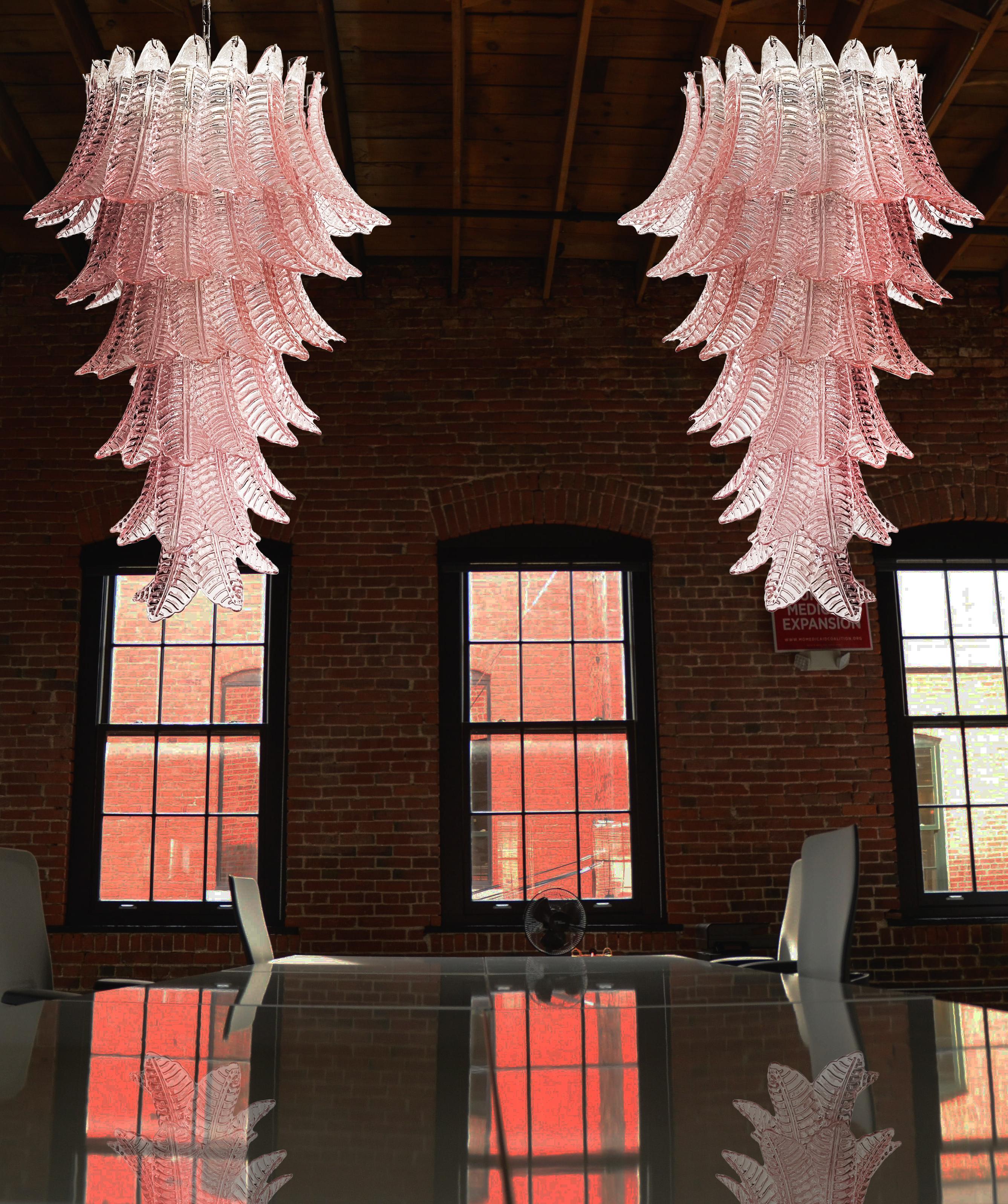 Beautiful and huge Italian Murano Chandeliers each composed by 83 splendid pink glasses that give a very elegant look. The glasses of these chandeliers are real works of art. The glasses descend with a spiral shape.
Dimensions: 71,70 inches (185 cm)