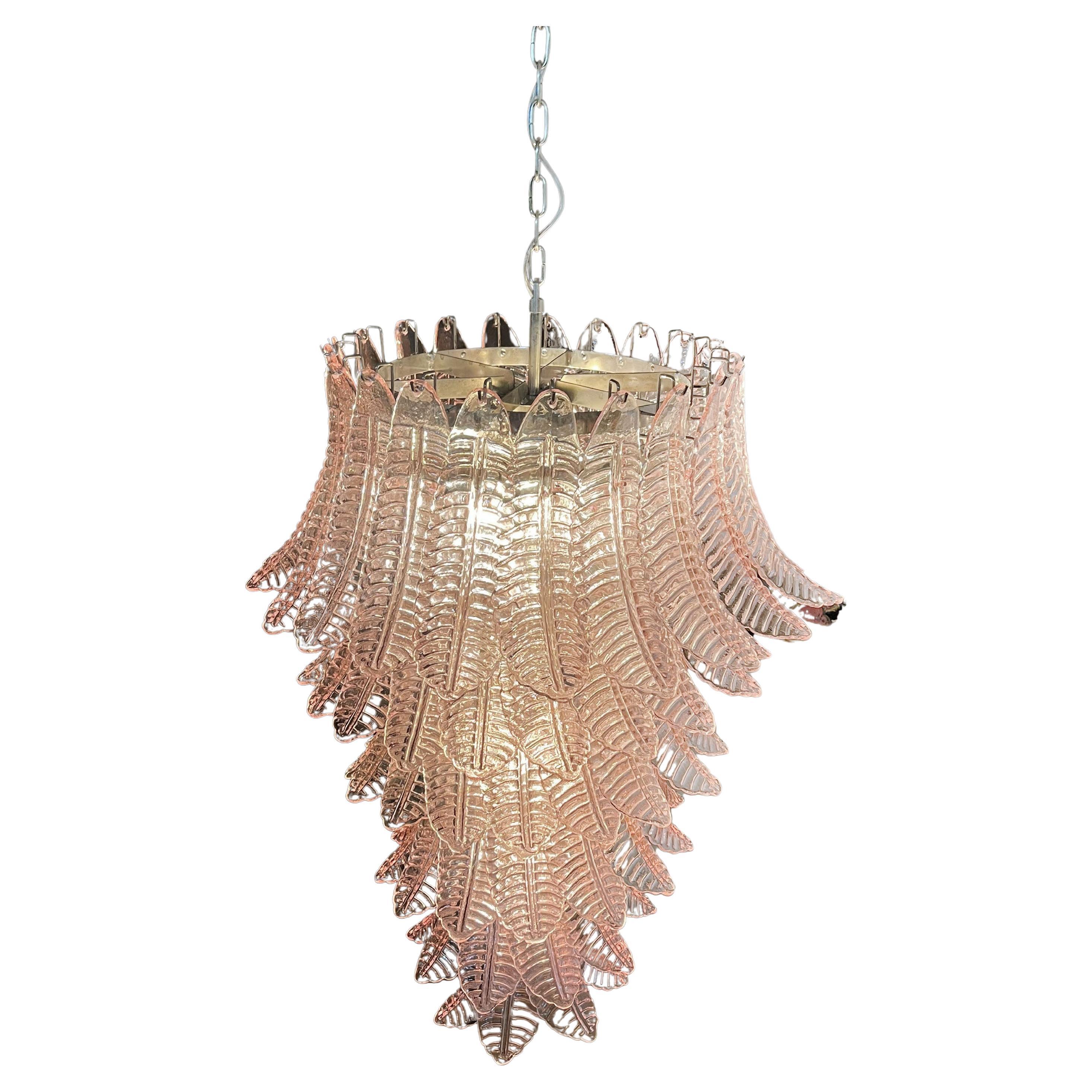 Beautiful and huge Italian Murano Chandeliers each composed by 83 splendid pink glasses that give a very elegant look. The glasses of these chandeliers are real works of art. The glasses descend with a spiral shape.
Dimensions: 71,70 inches (185 cm)