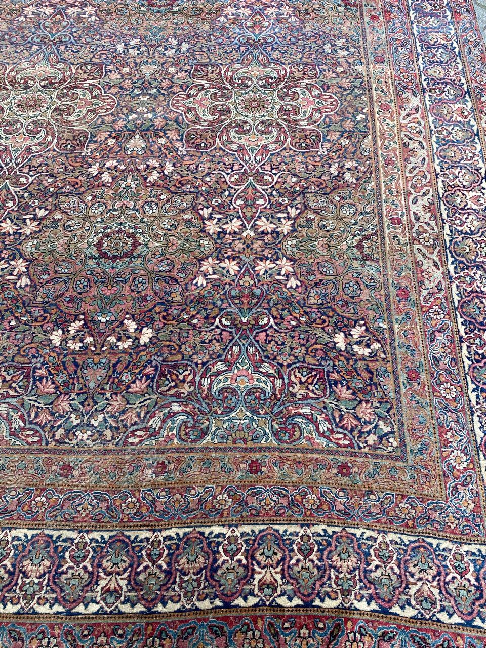 Wonderful and luxurious antique large rug with nice floral and decorative design and beautiful natural colors, entirely and very finely hand knotted with wool velvet on cotton foundation.