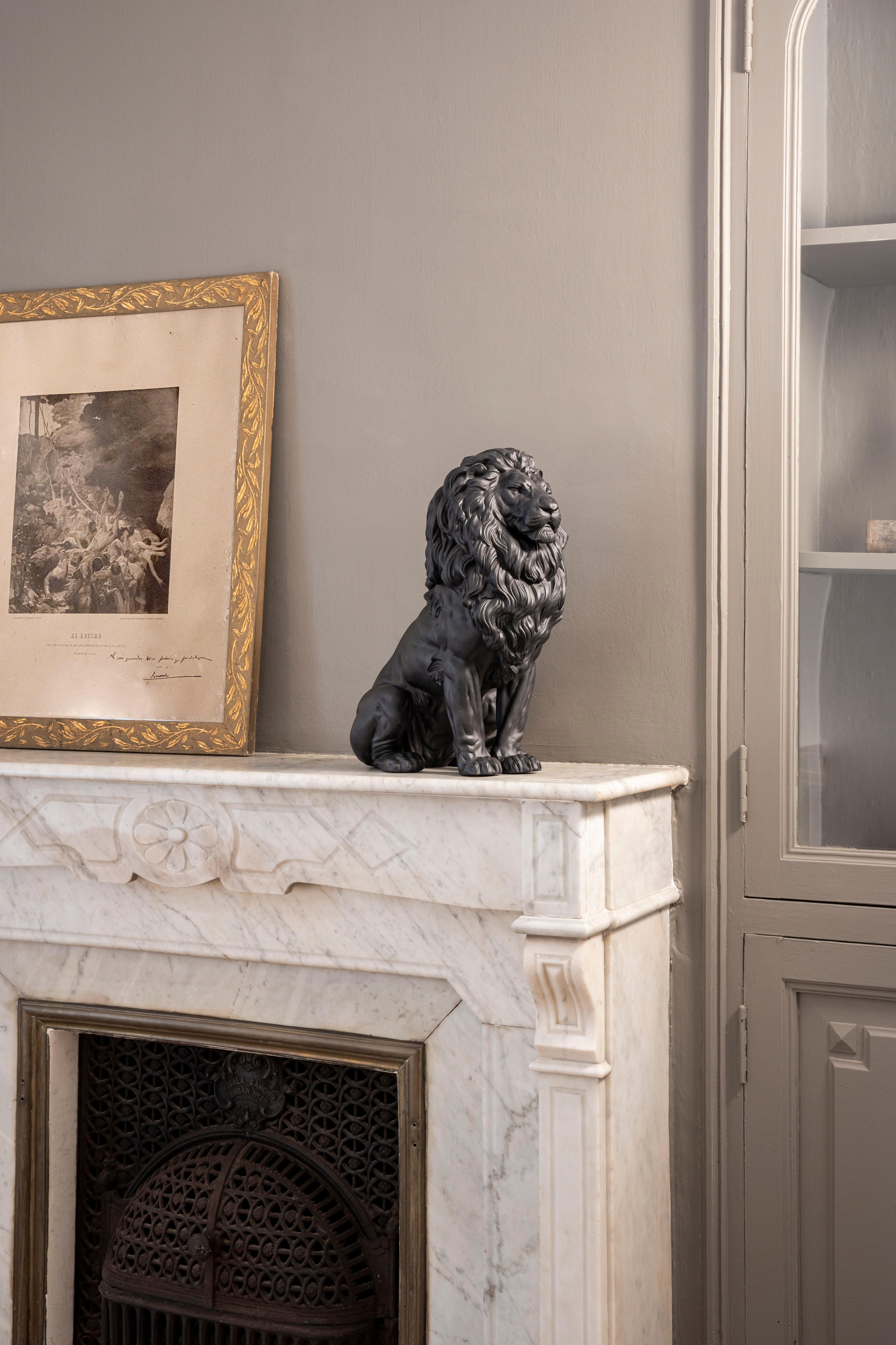 Lion handcrafted in matte black porcelain. From the guardians of ancient gates of Babylonia to the imposing lions in Trafalgar Square, throughout history this animal has been a universal symbol of strength, nobility and courage. Widely portrayed in