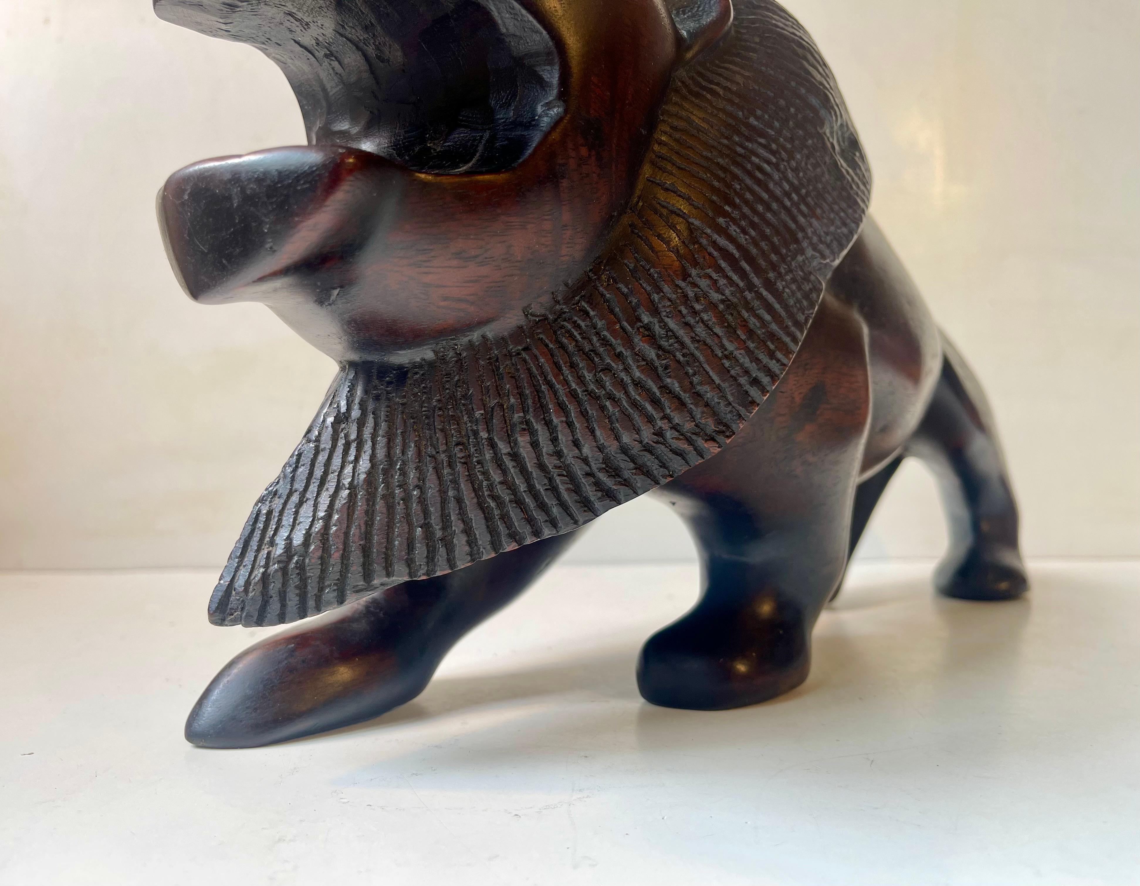 Art Deco Majestic Lion Sculpture in Carved Dark Hardwood For Sale