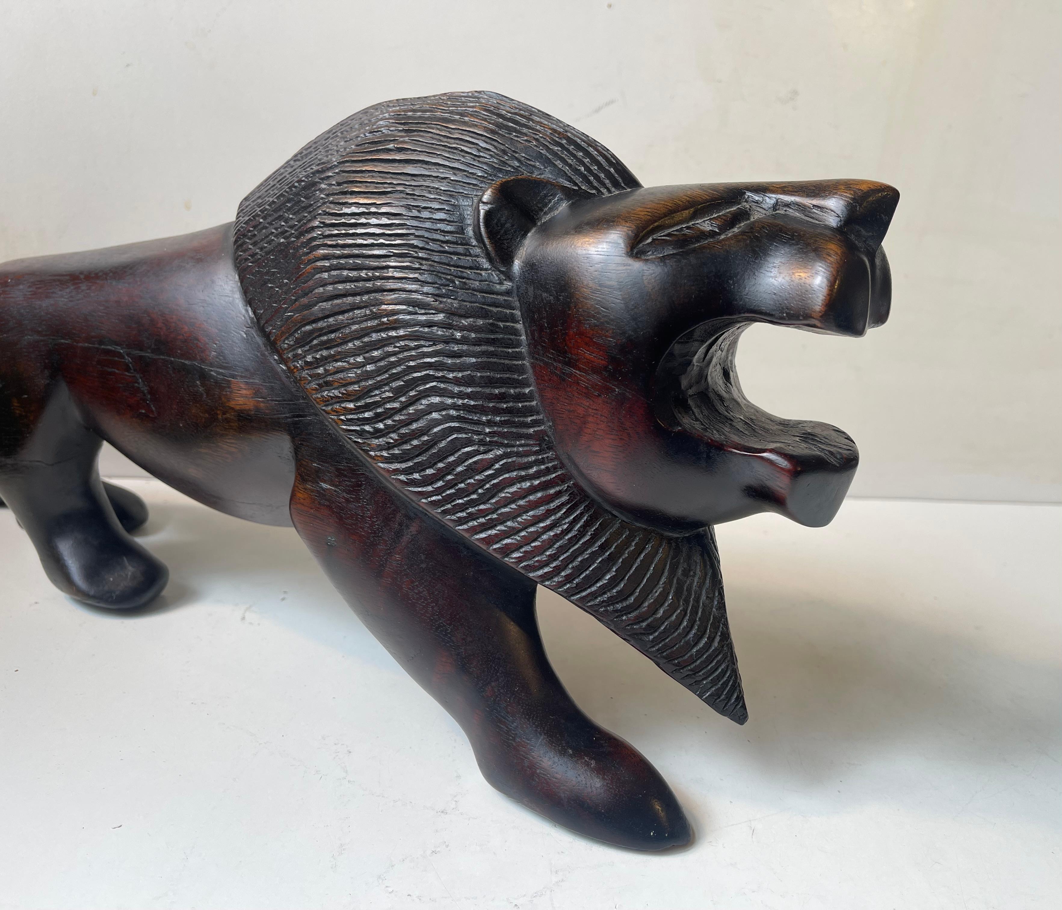 20th Century Majestic Lion Sculpture in Carved Dark Hardwood For Sale