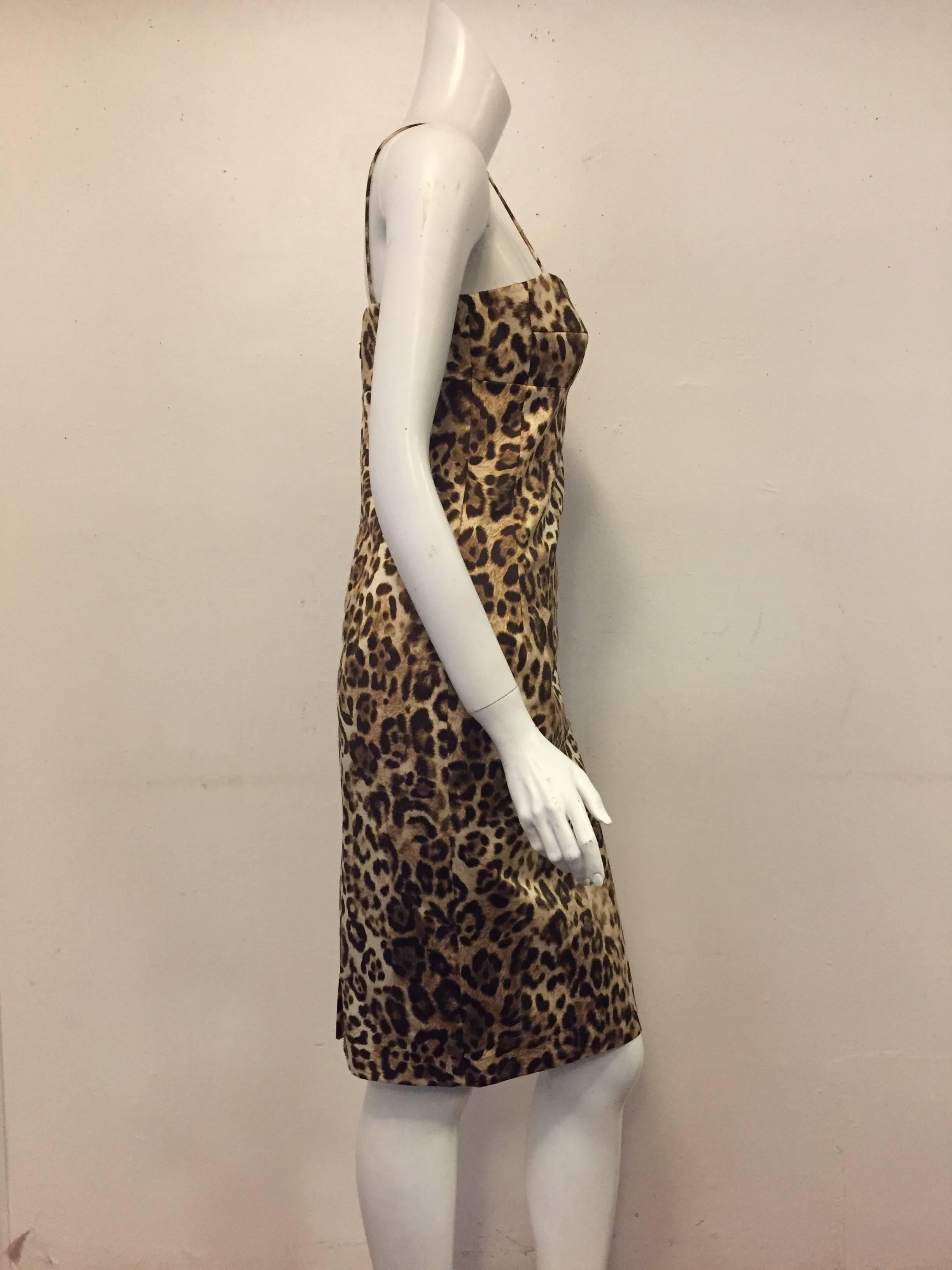 Michael Kors dress features a rust and black leopard print allover.  Flattering sweetheart neckline with spaghetti straps and body hugging silhouette is timeless and goes from day to evening with ease.  Wear belted, or not.  Fully lined.  Excellent