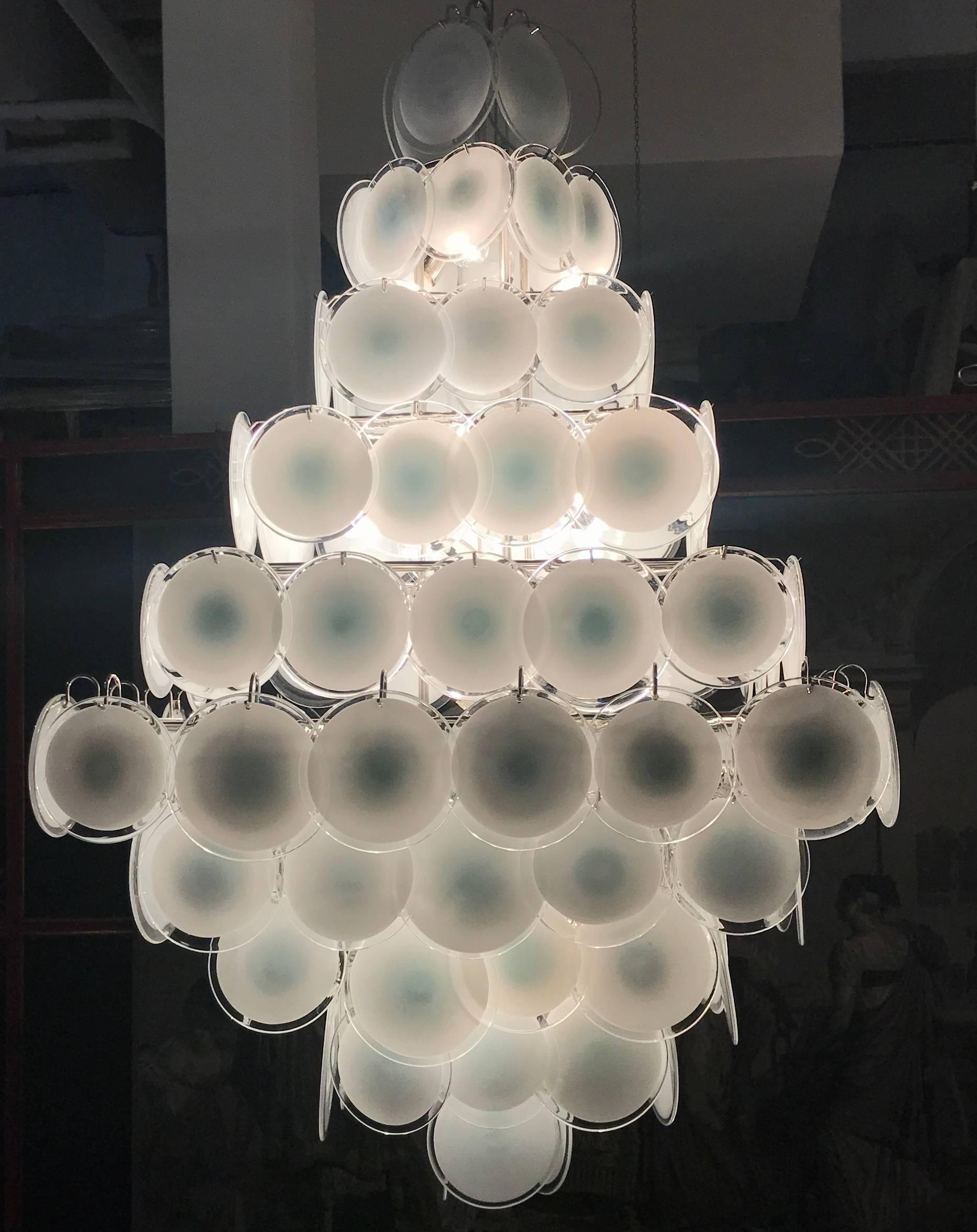 A chandelier of rare beauty and elegance. 134 Murano white
'lattimo' glass discs, disposed in ten rows, forming two overlapping pyramids. A pair is available.
We can rewire for Us standards.