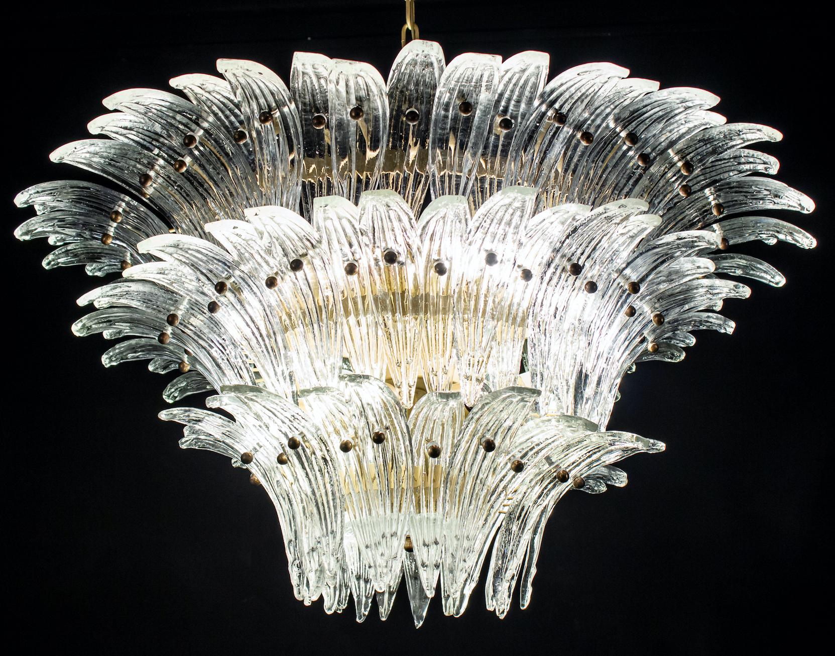 Luxury Palmette murano glass chandelier made with 94 original crystal glasses .
Bronze metal frame.
Available also a pair and a pair of sconces.
12-light bulbs, E27 dimension
Dimensions: Chandelier 43.30 inches (110 cm), height with chain. Without