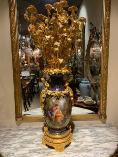 Majestic pair Sevres style porcelain and gilt bronze candleabrum/garnitures