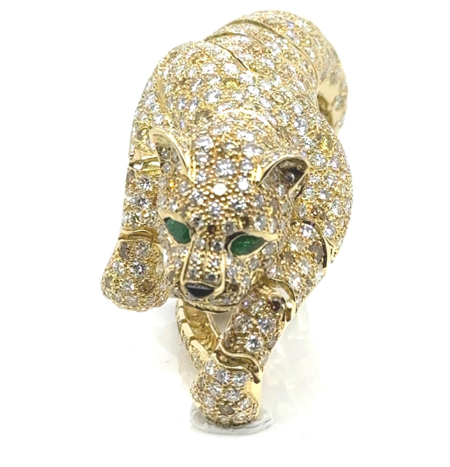 Gemstone
Diamond: 31.88 Carat
Emerald: 0.41
Metal: 18K Yellow Gold

                 Indulge in the captivating allure of the Majestic Panther Diamond Bracelet/Brooch, a true embodiment of beauty, rarity, and timeless value. This extraordinary piece
