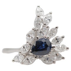 Majestic pear-cut sapphire with navette diamond-cut ring in 18k white gold.