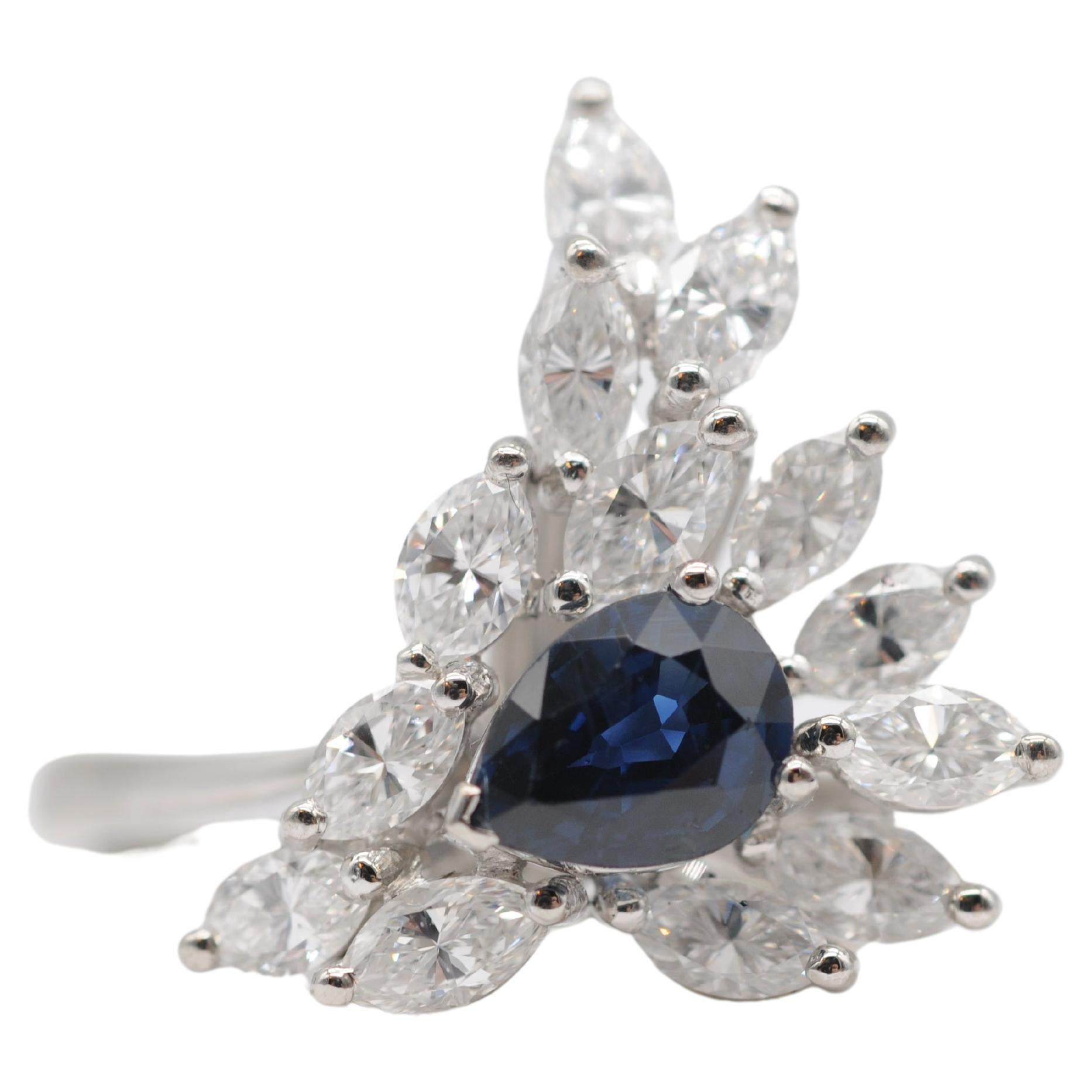 Majestic pear-cut sapphire with navette diamond-cut ring in 18k white gold. For Sale