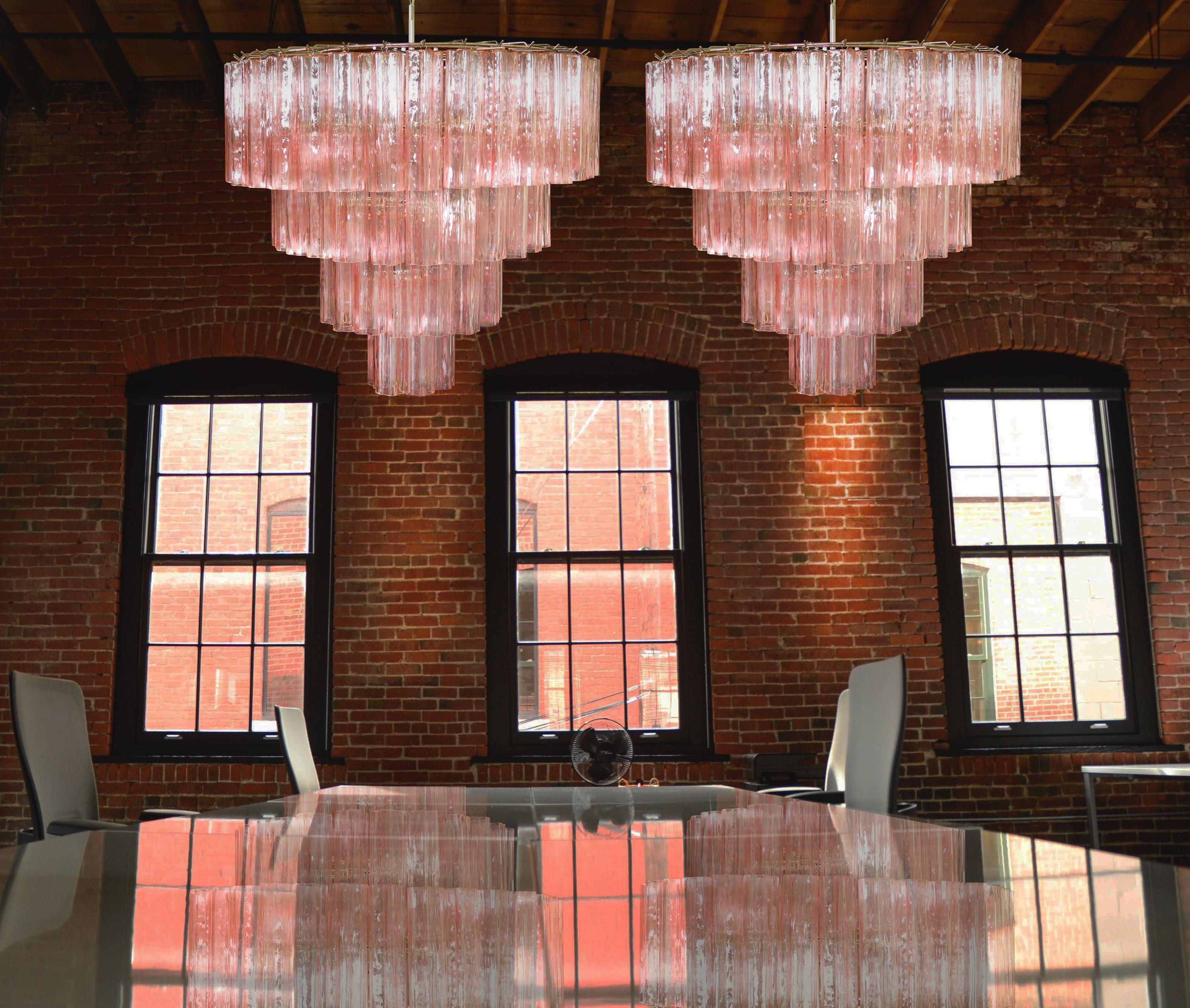 Italian chandelier in Murano glass and nickel-plated metal structure on 4 levels. The armor polished nickel supports 78 large pink glass tubes in a star shape.
Dimensions: 63 inches (160 cm) height with chain, 35.45 inches (90 cm) height without
