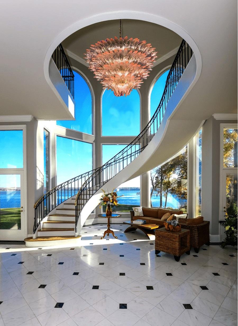 Outstanding pink Palmette Murano glass chandelier made with 163 precious glasses on four levels.
Gold painted metal frame.
Available also a pair and a pair of sconces.
12-light bulbs, E27 dimension
Dimensions: 55.10 inches (140cm) height with chain,