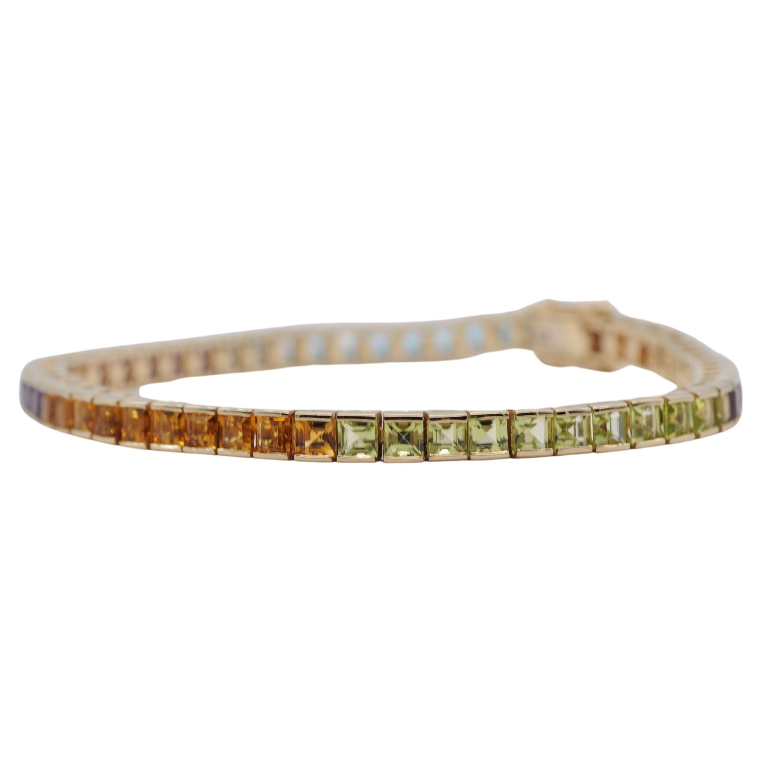 Indulge in the dreamlike beauty of this exquisite tutti frutti bracelet, adorned with an array of stunning gemstones totaling 56 in number, each meticulously cut in princess cut. This captivating piece features a harmonious blend of colors,