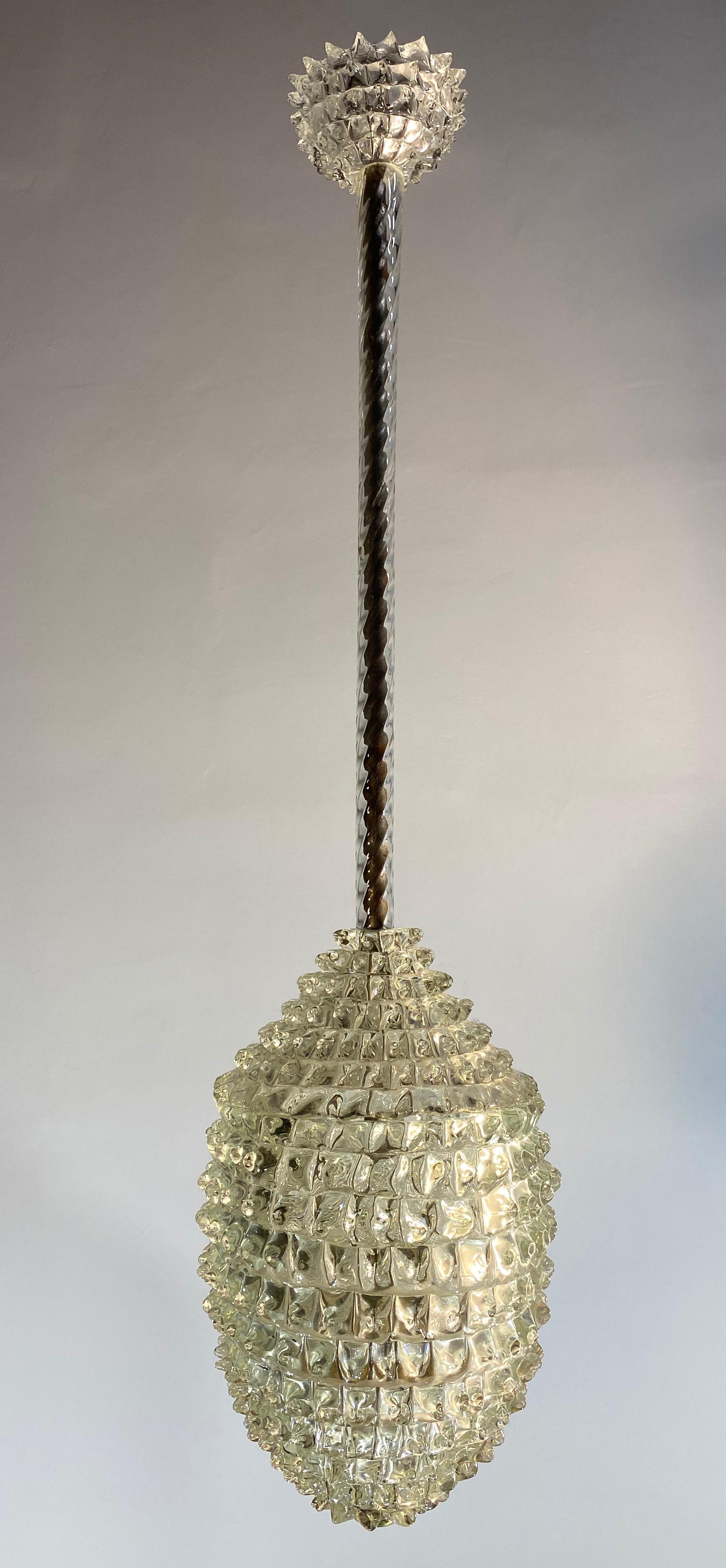 Original 1940s Murano glass pendant by Ercole Barovier made in the “rostrato” technique with iron and brass hardware.
No flaws, perfect holds three sockets each 70/100watt.
